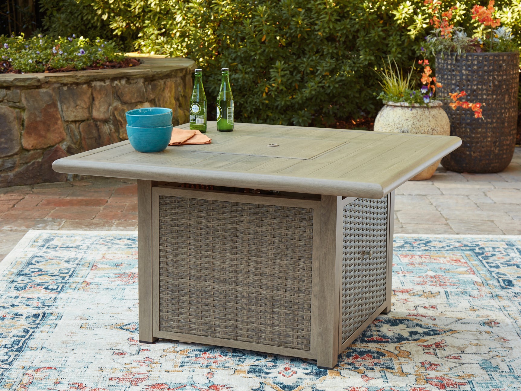 Close up on woven resin wicker with beige powder coat finish