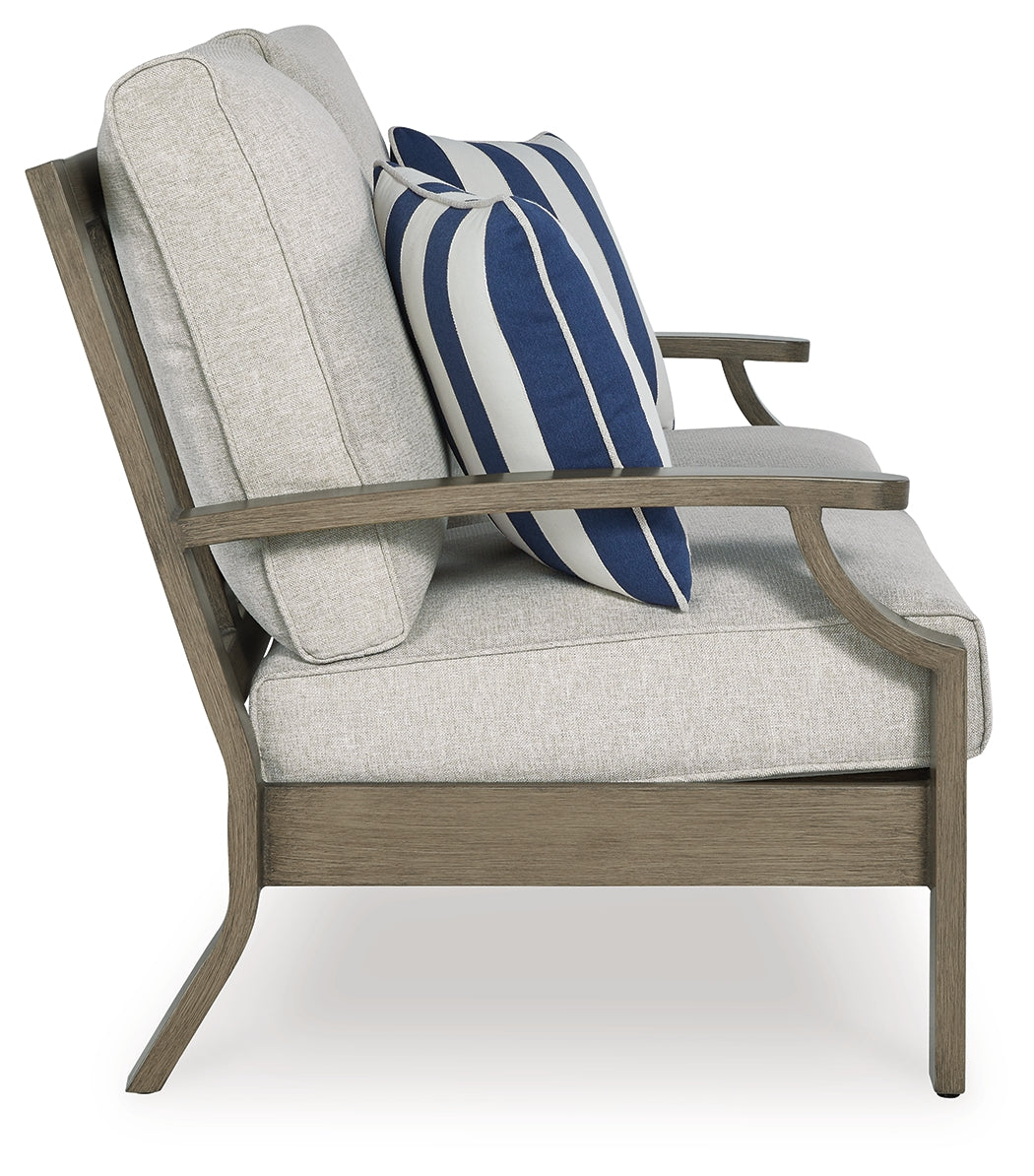 Rainier Ranch outdoor loveseat, two chairs, and coffee table set in brown and beige