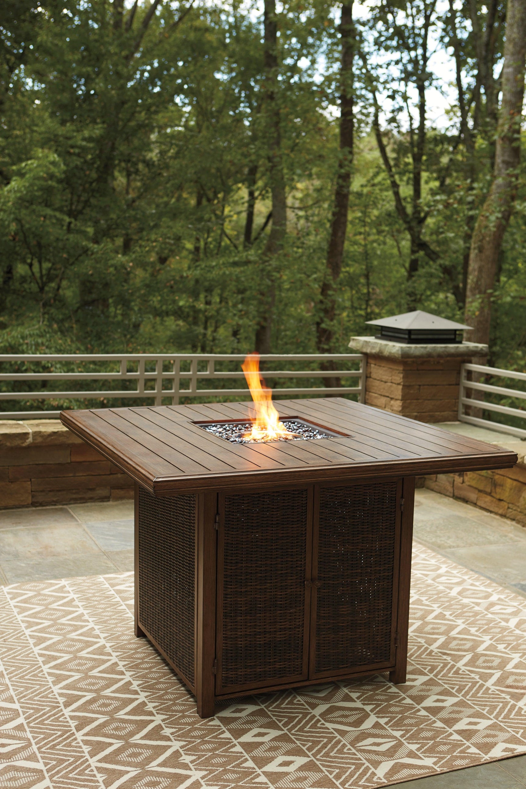 Paradise Trail Medium Brown Outdoor Bar Table with Fire Pit setting with accessories