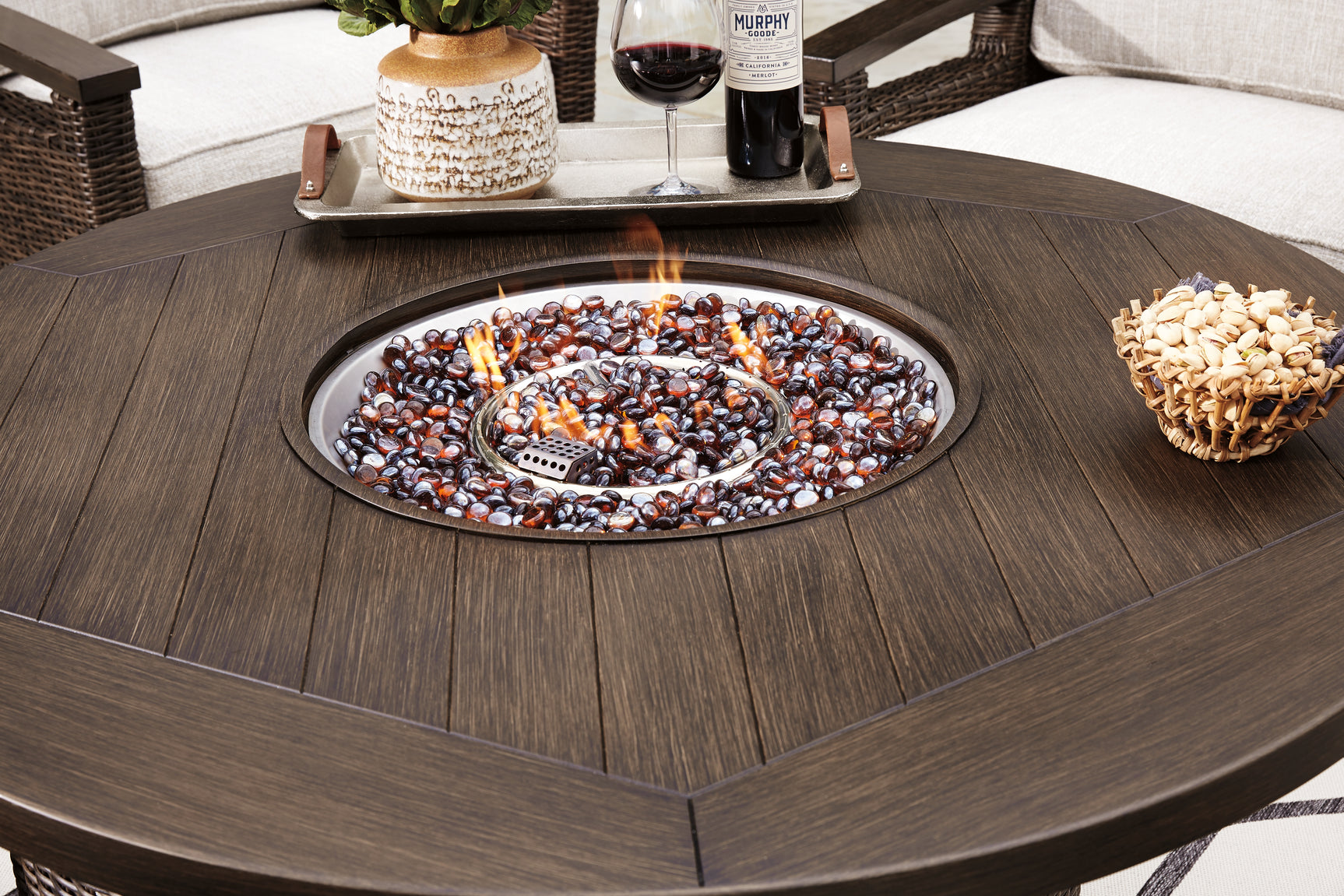 Captured flame on fire pit table