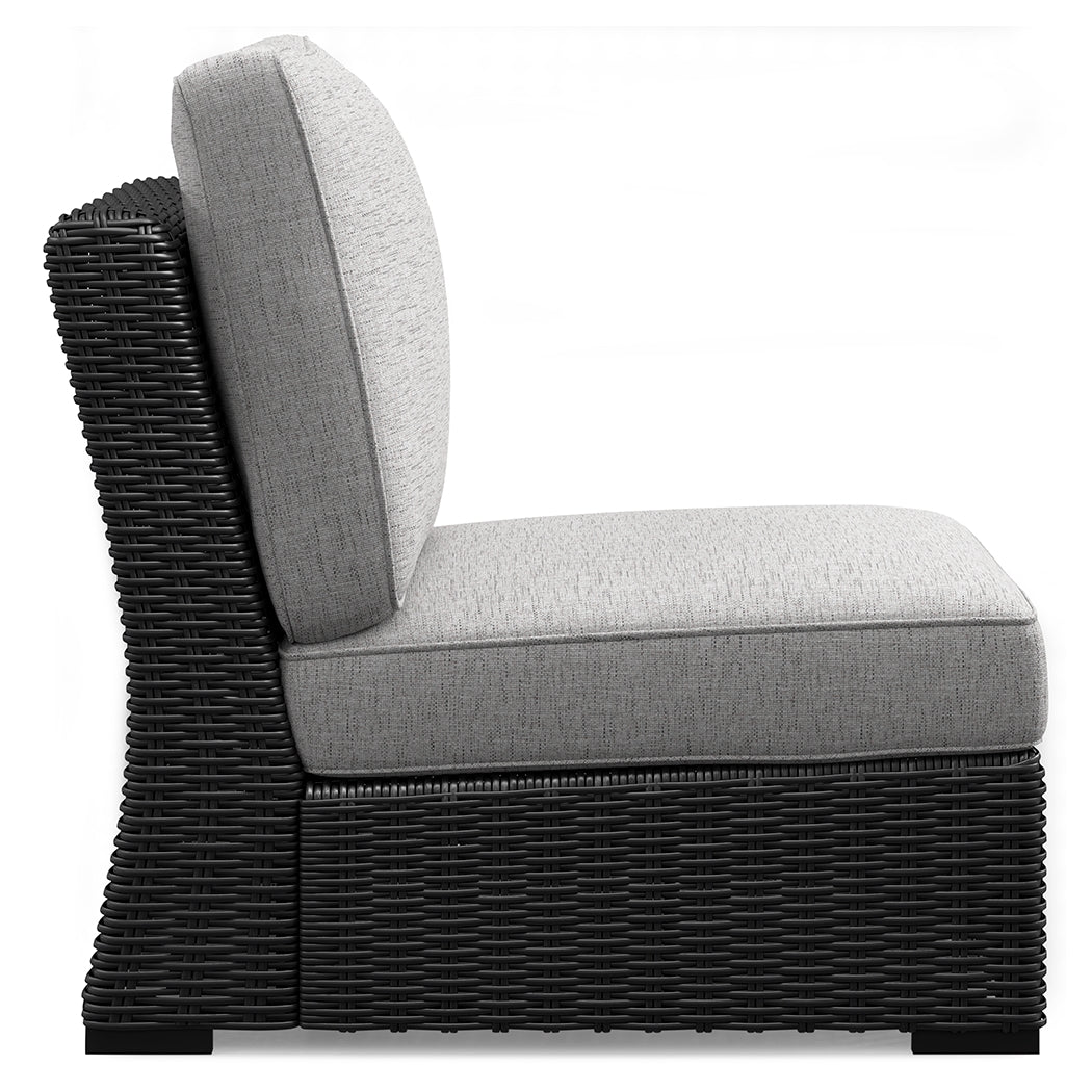 Side angle of the Beachcroft sectional showing resin wicker weave