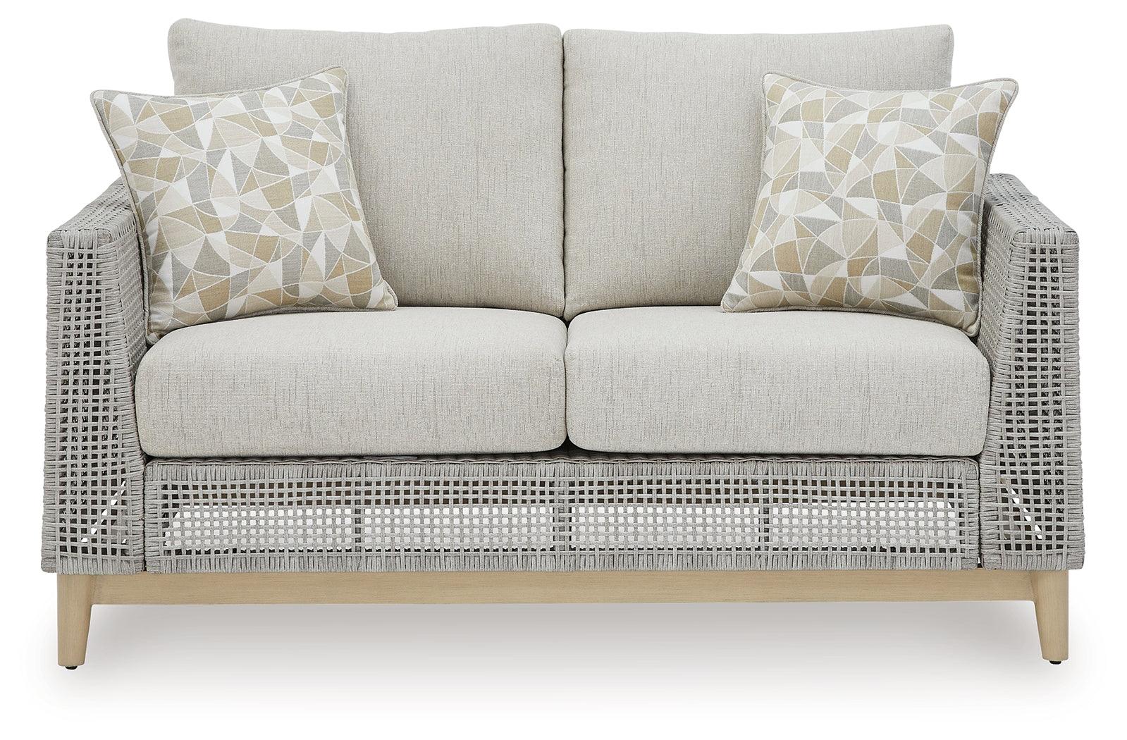 Seton Creek gray outdoor loveseat with cushion head-on view