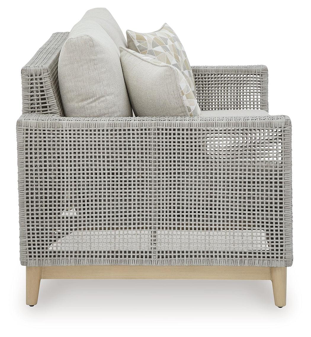 Seton Creek gray outdoor loveseat with cushion side angle