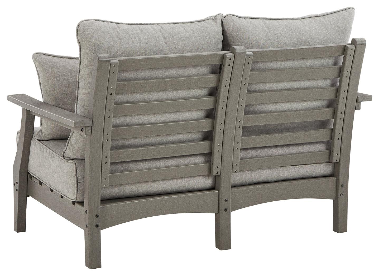 Visola Gray Outdoor Loveseat with throw pillows close-up