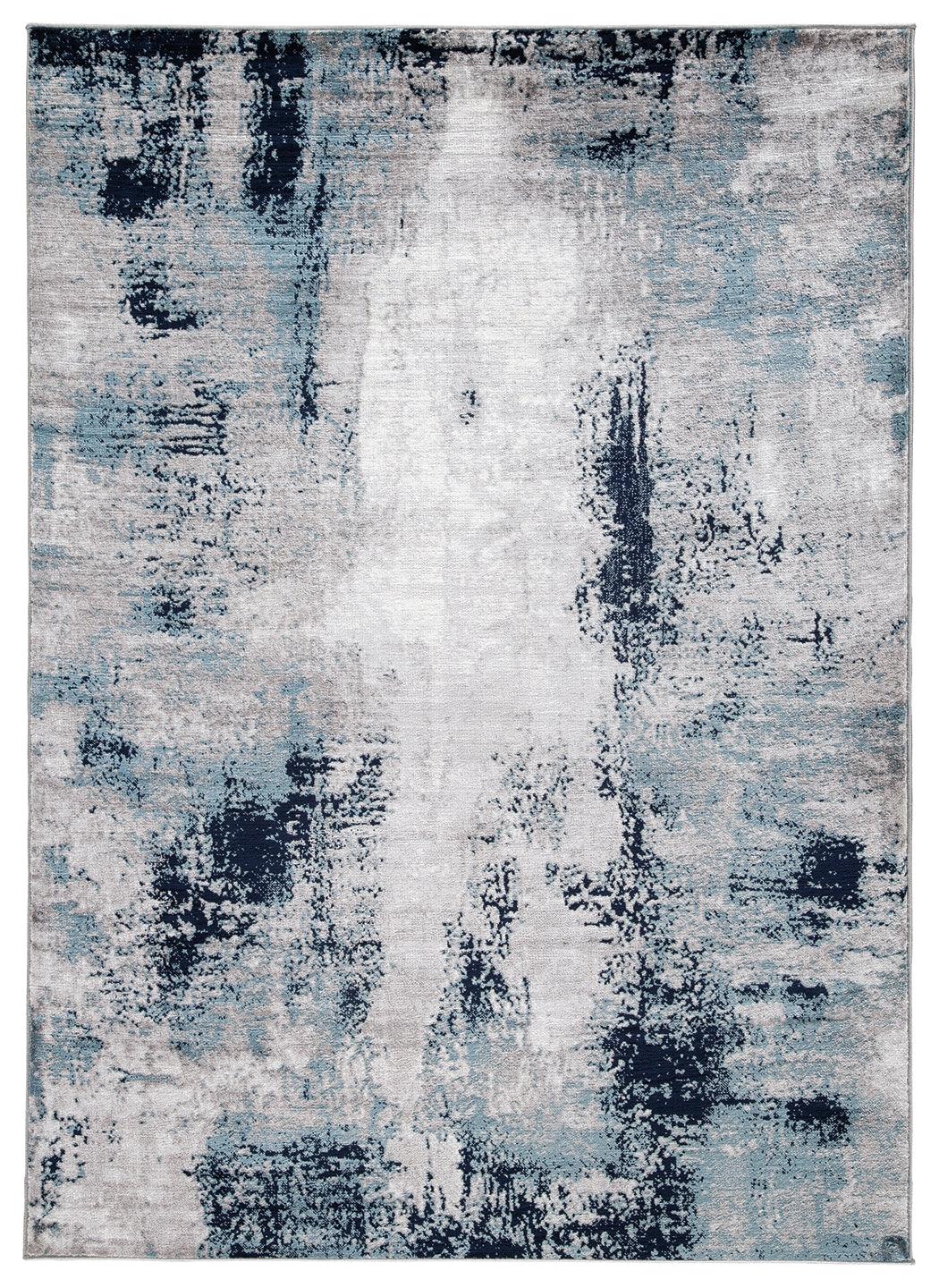 Close-up detail of Leonelle rug’s abstract pattern in white, blue, and gray
