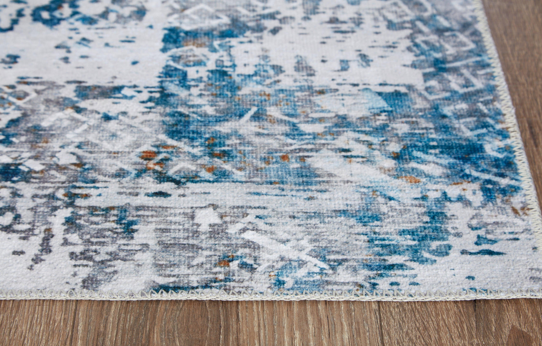 Garyard Multi 5x7 rug rolled detail displaying backing texture