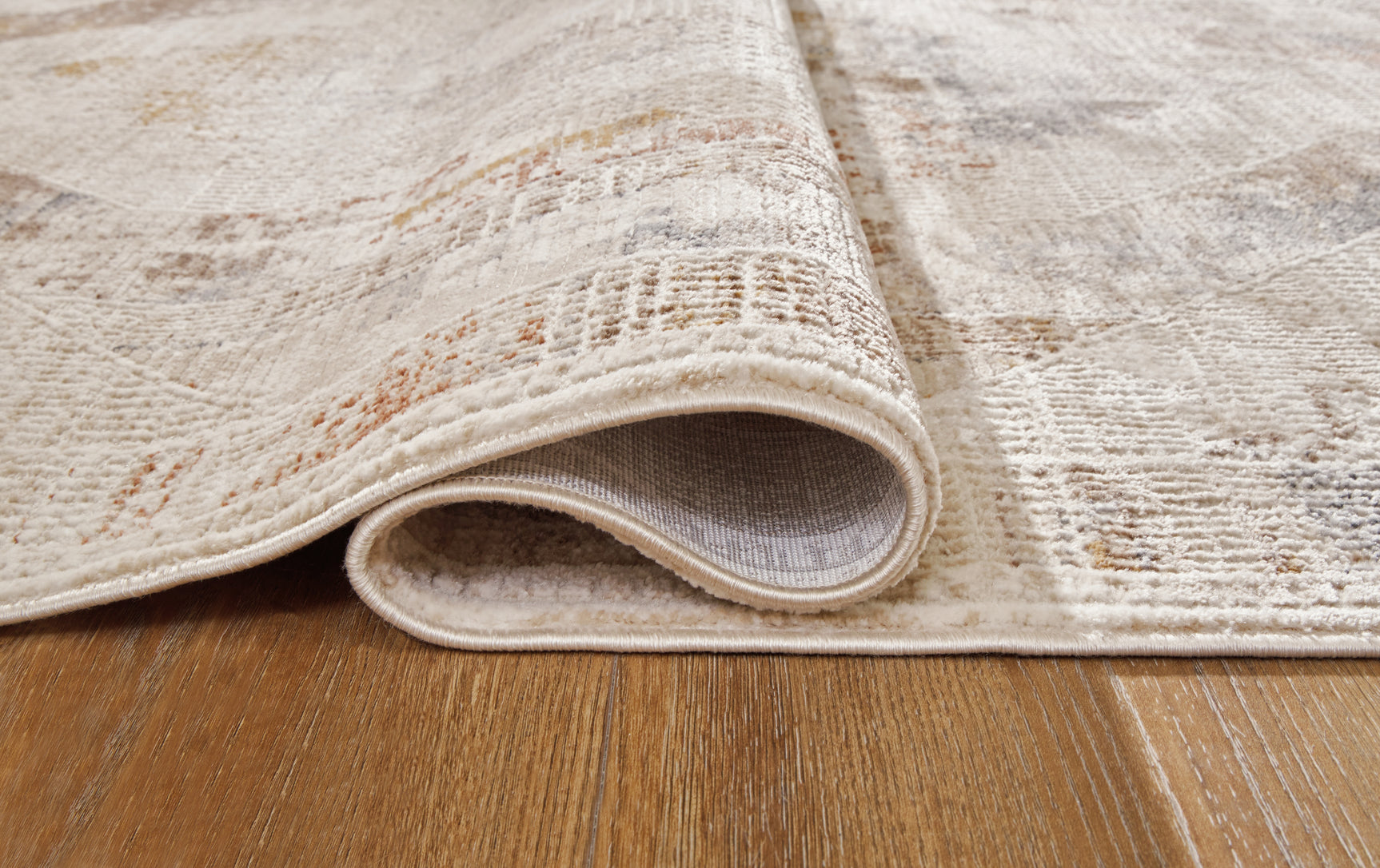 Rolled view of Varnwood Multi Large Rug