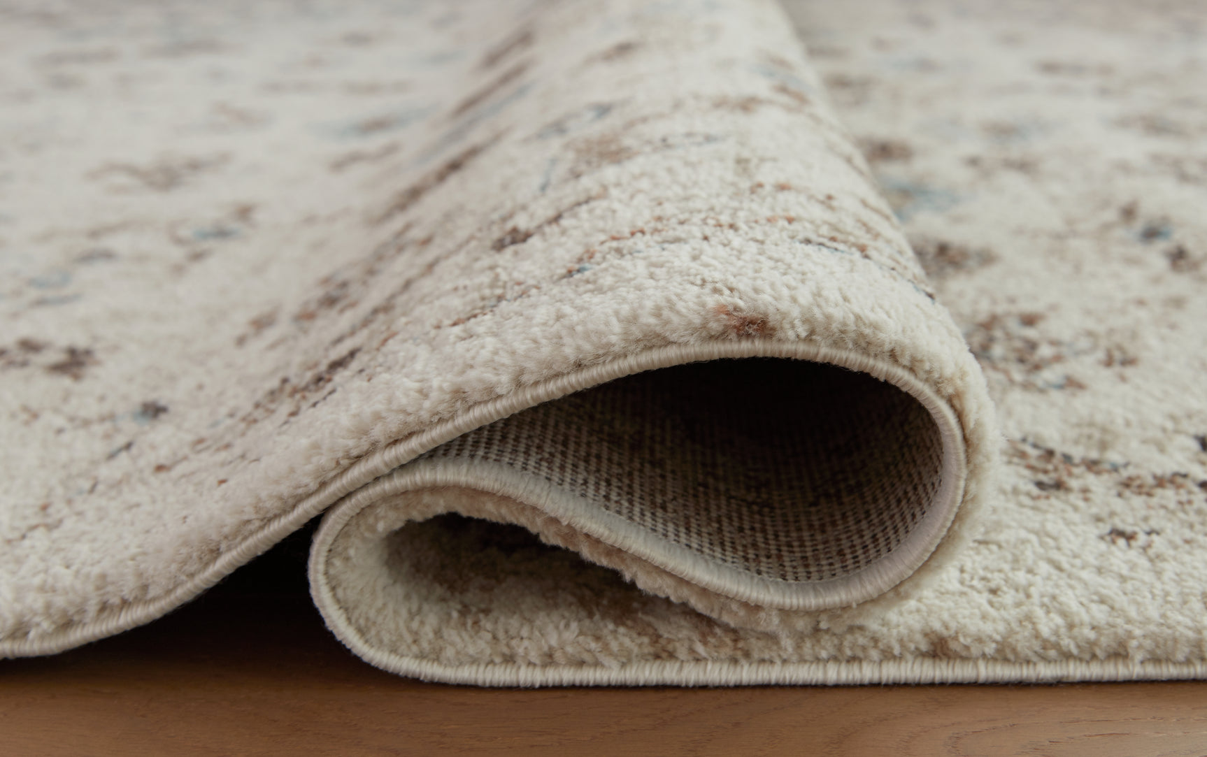 Rolled detail view of Jossler polypropylene rug edge