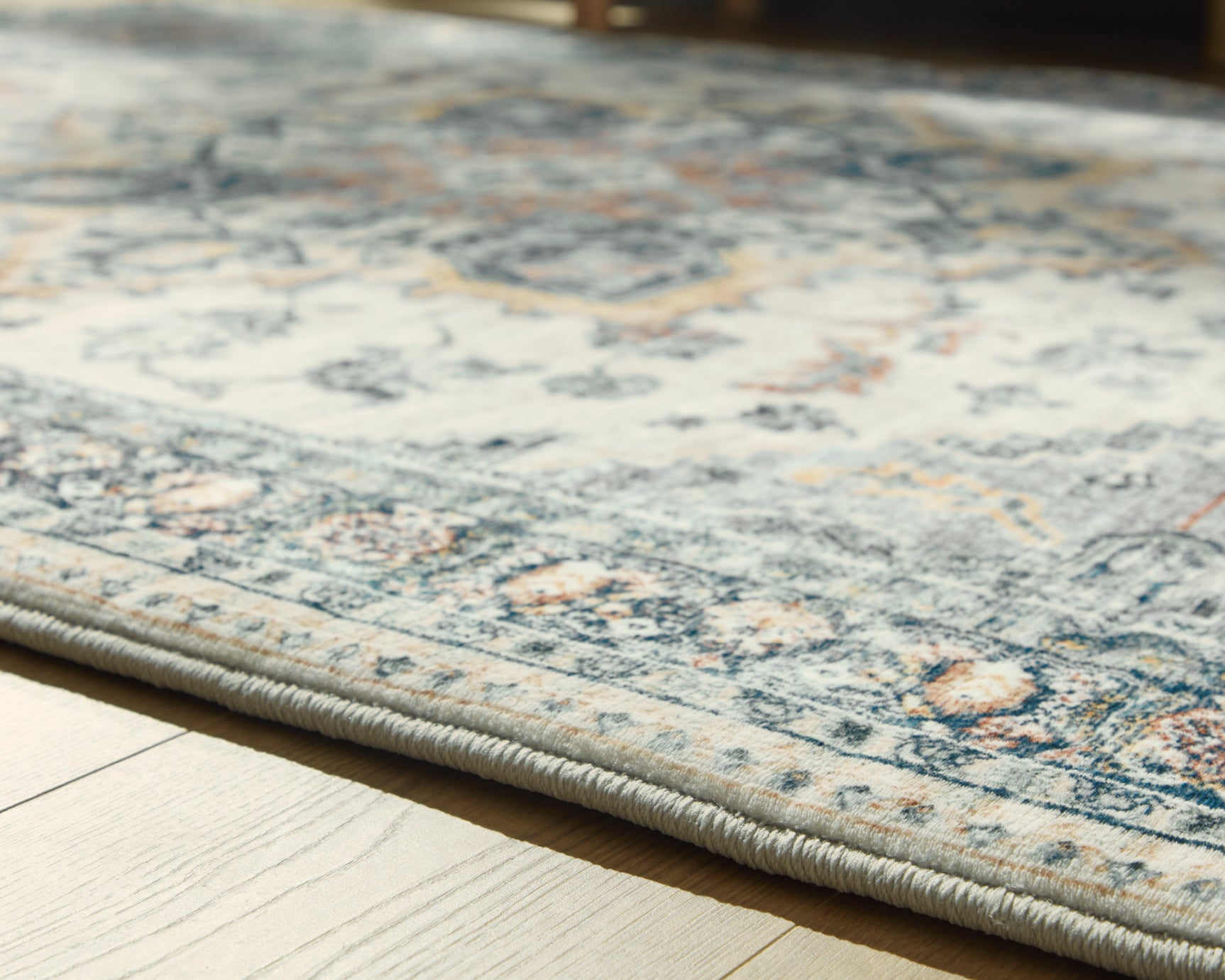 Rolled Wallney Memory Foam Area Rug showing thickness and foam pad