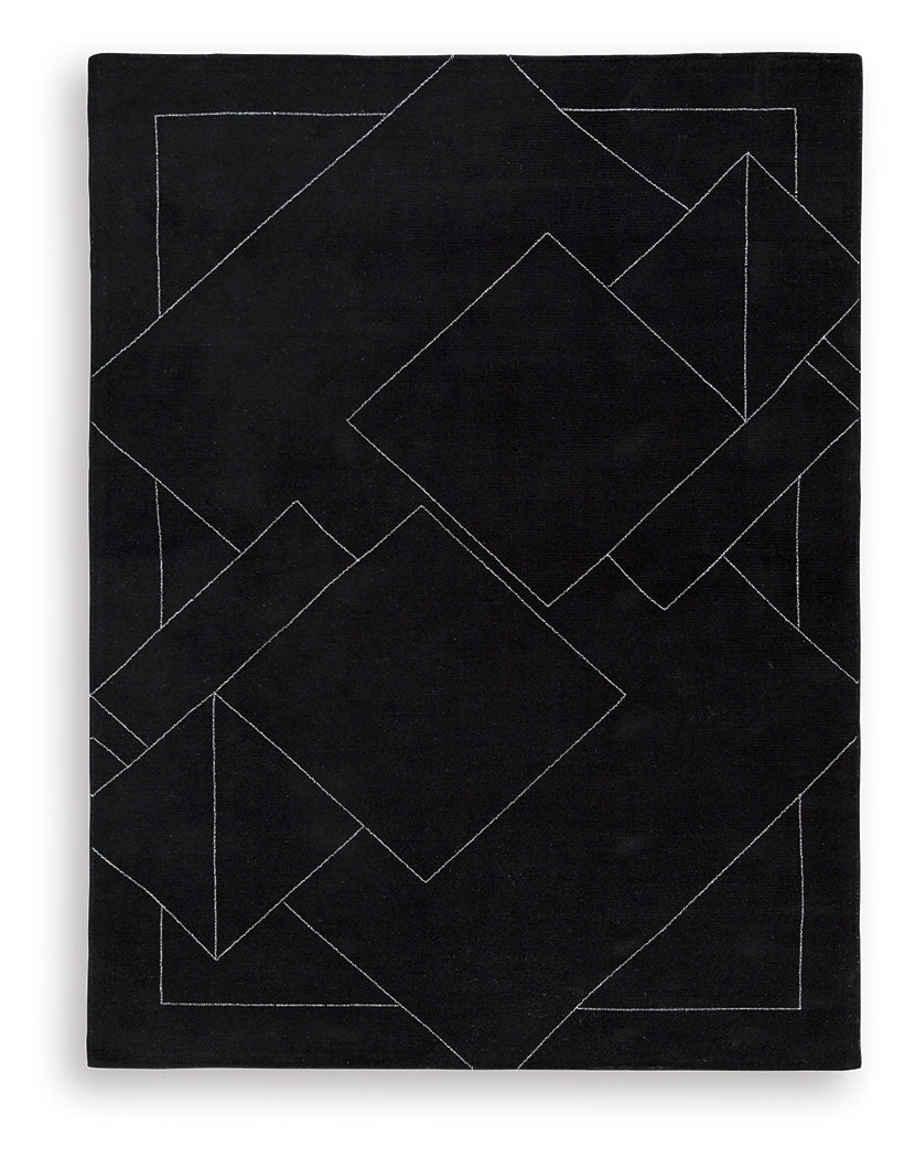Close up of black and white geometric wool rug texture
