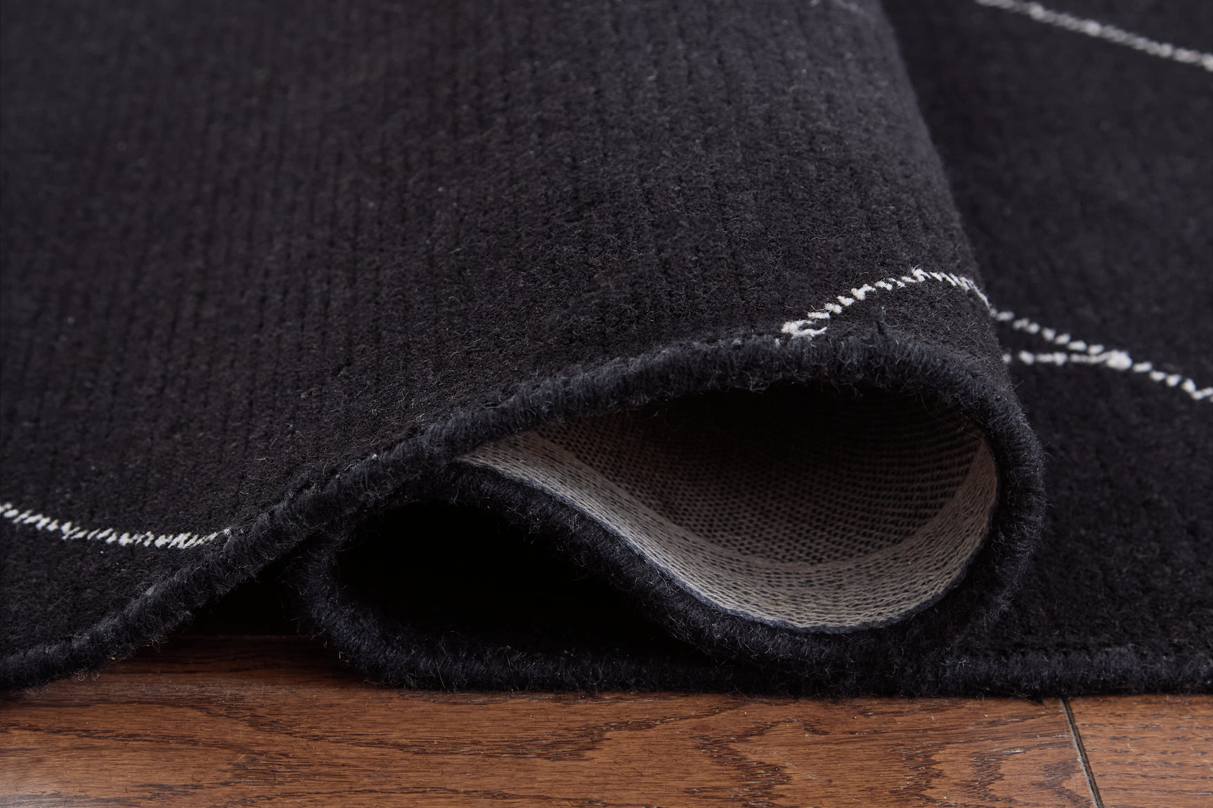 Detail of Marav rug edge and cotton backing
