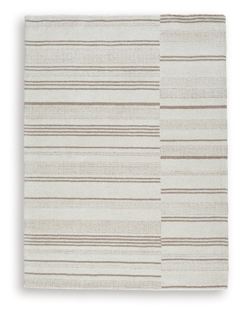 Close-up detail of Gadence ivory and tan area rug pattern