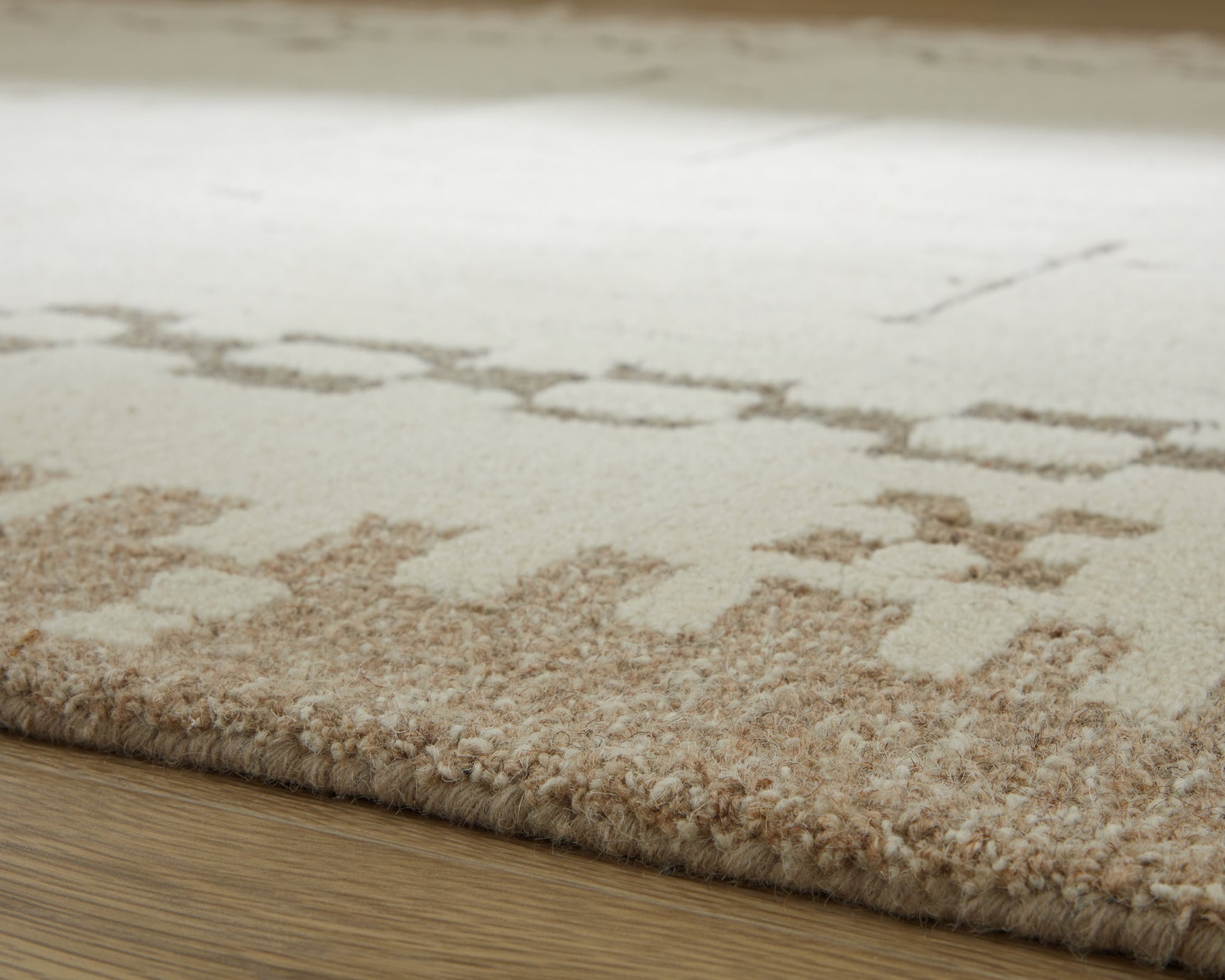Folded corner showing wool pile and cotton backing of Dot rug