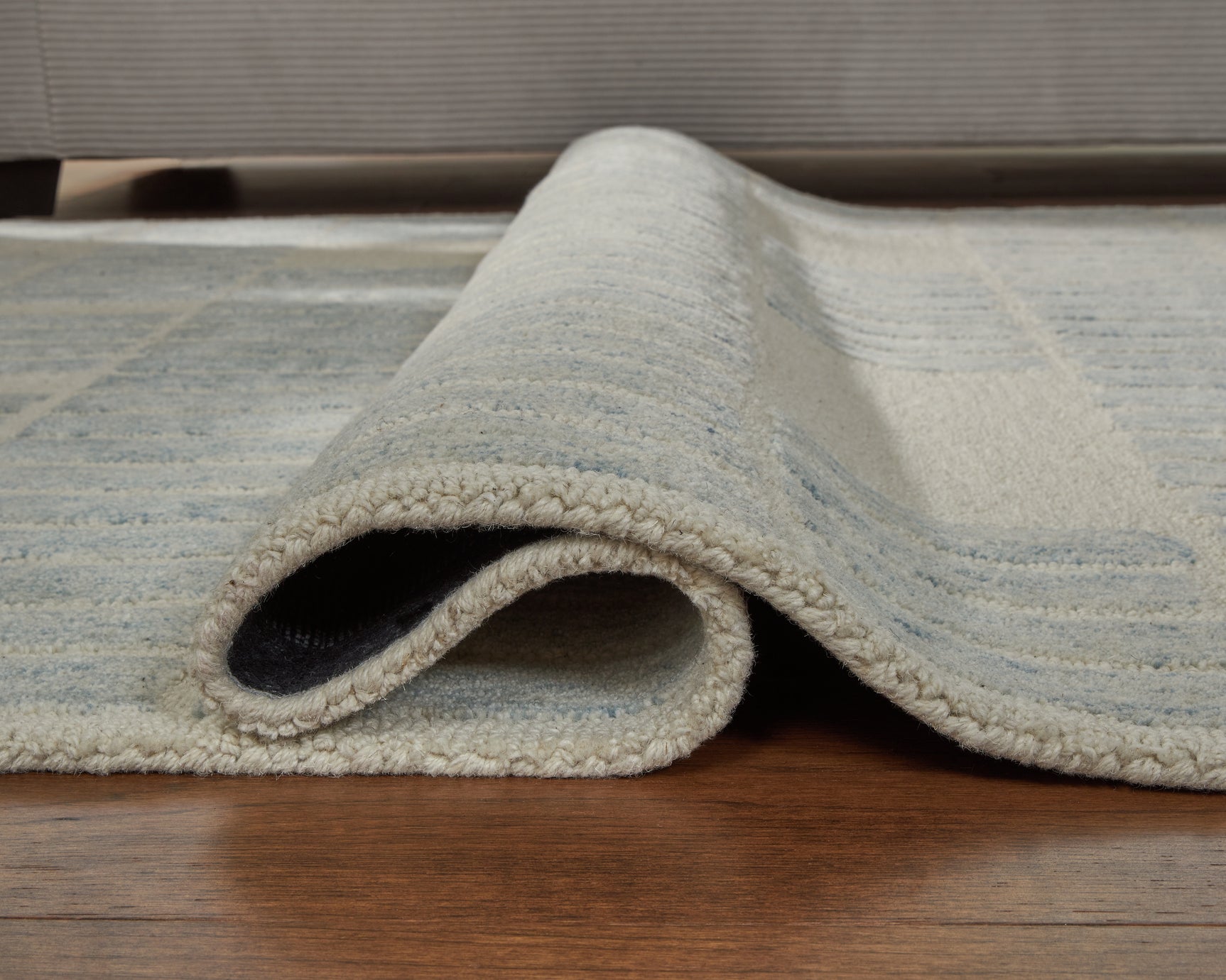 Rolled view of Dylanton 5x7 area rug