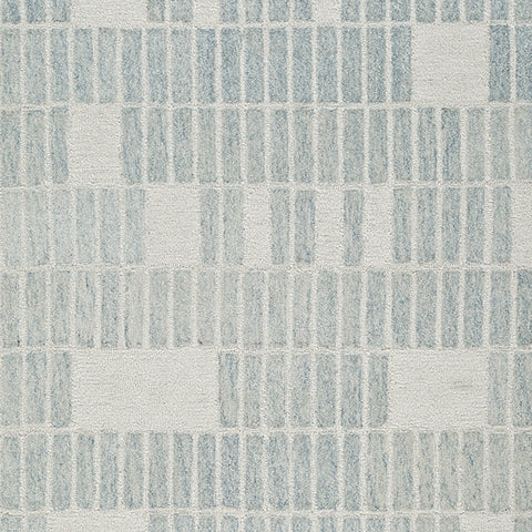 Color swatch of ivory and blue shades on rug