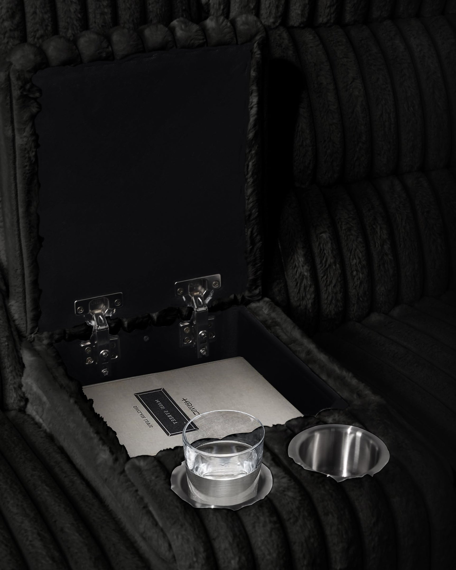 Close-up of sectional storage console with cupholders