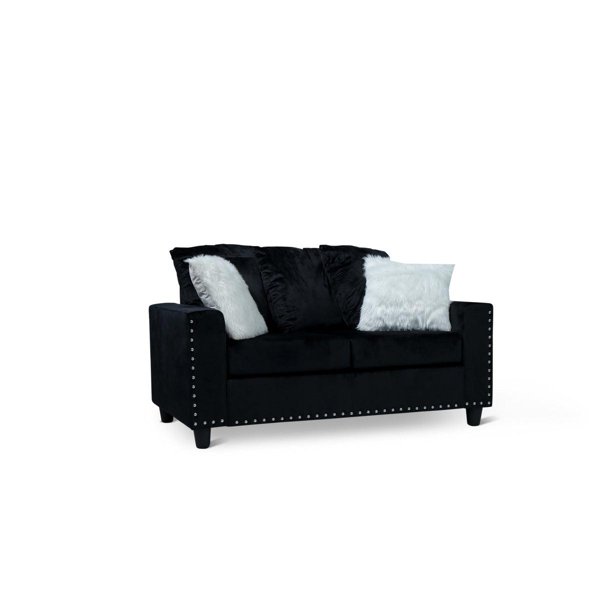 Black velvet loveseat with two pillows, side view