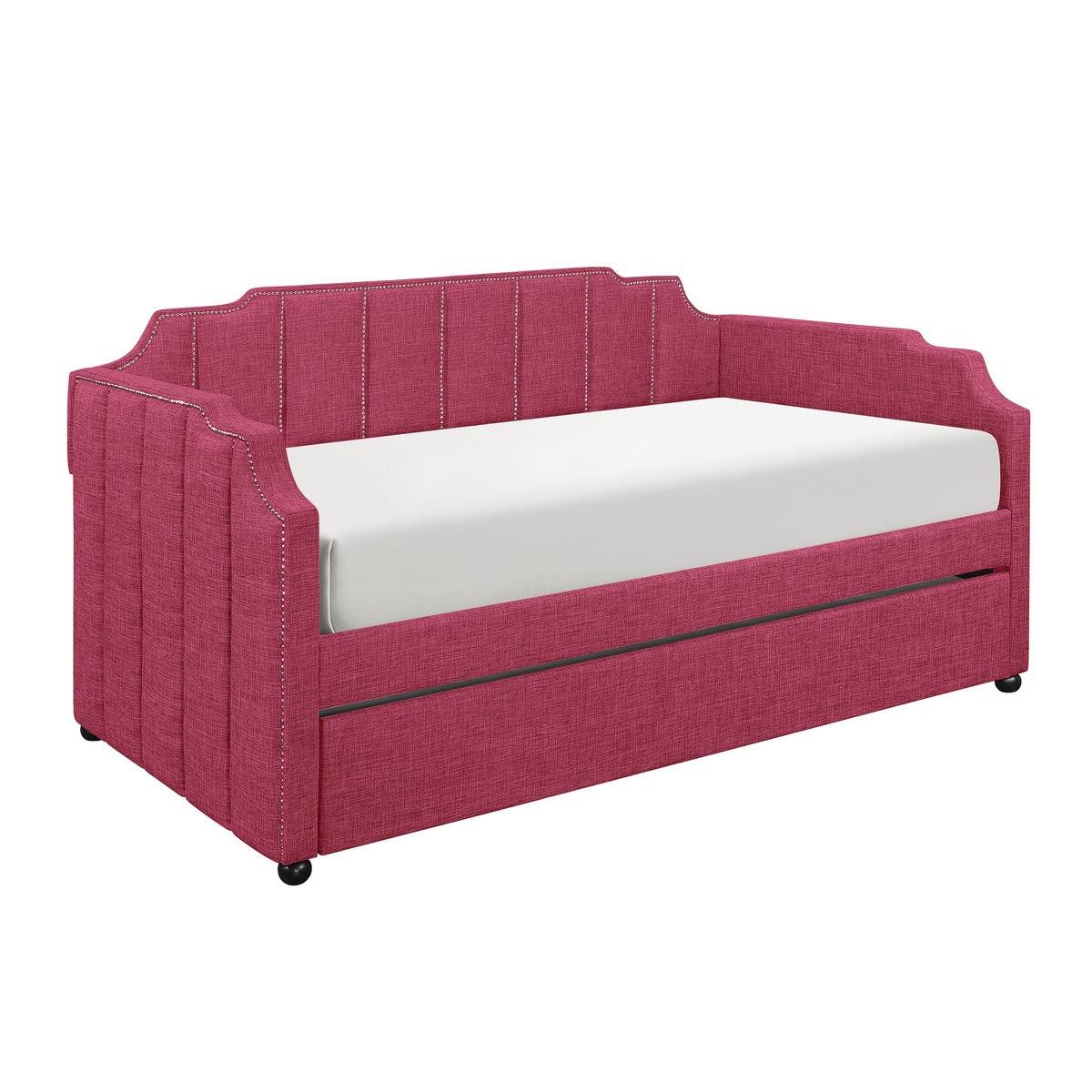 Close-up of pink fabric upholstery and solid wood frame on trundle daybed