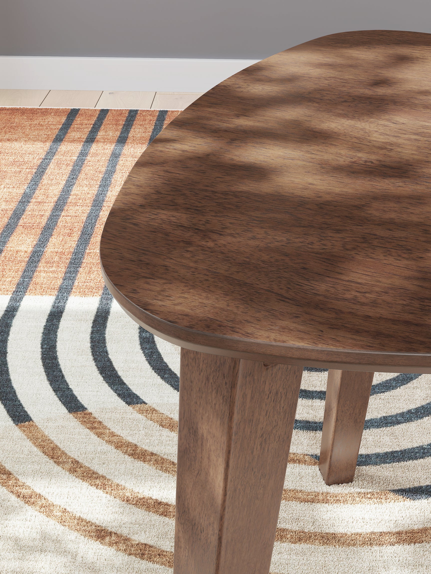 Lyncott Medium Brown Wood Table Set displayed with decor