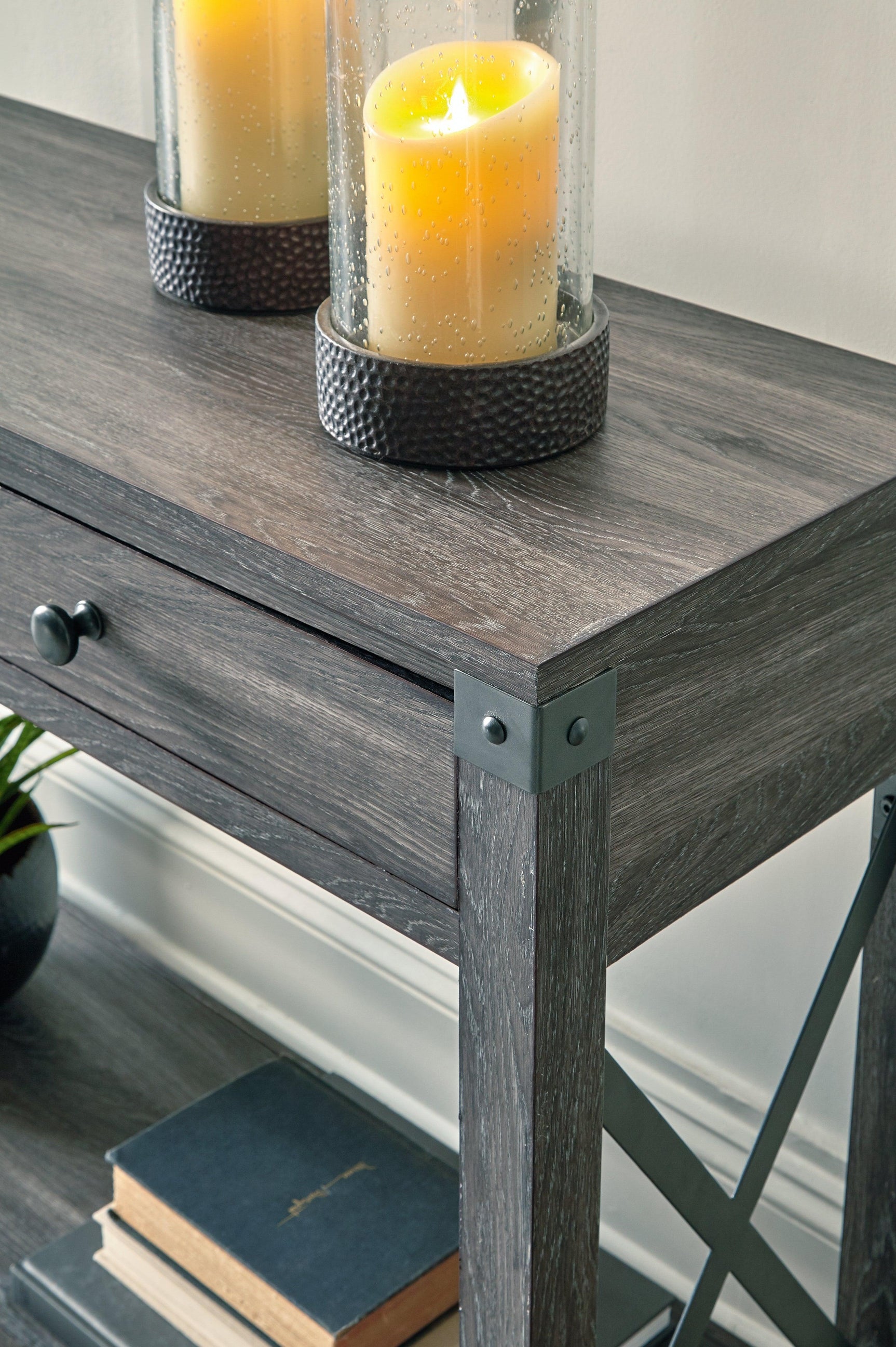 Close-up of drawer and metal hardware on Freedan Grayish Brown sofa console table