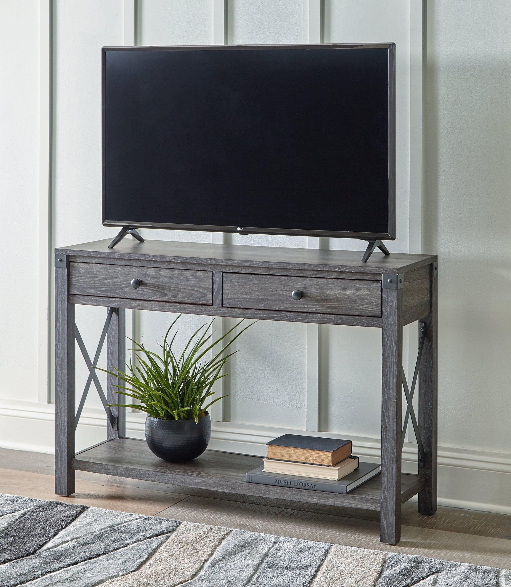 Freedan Grayish Brown sofa console table with decorative items