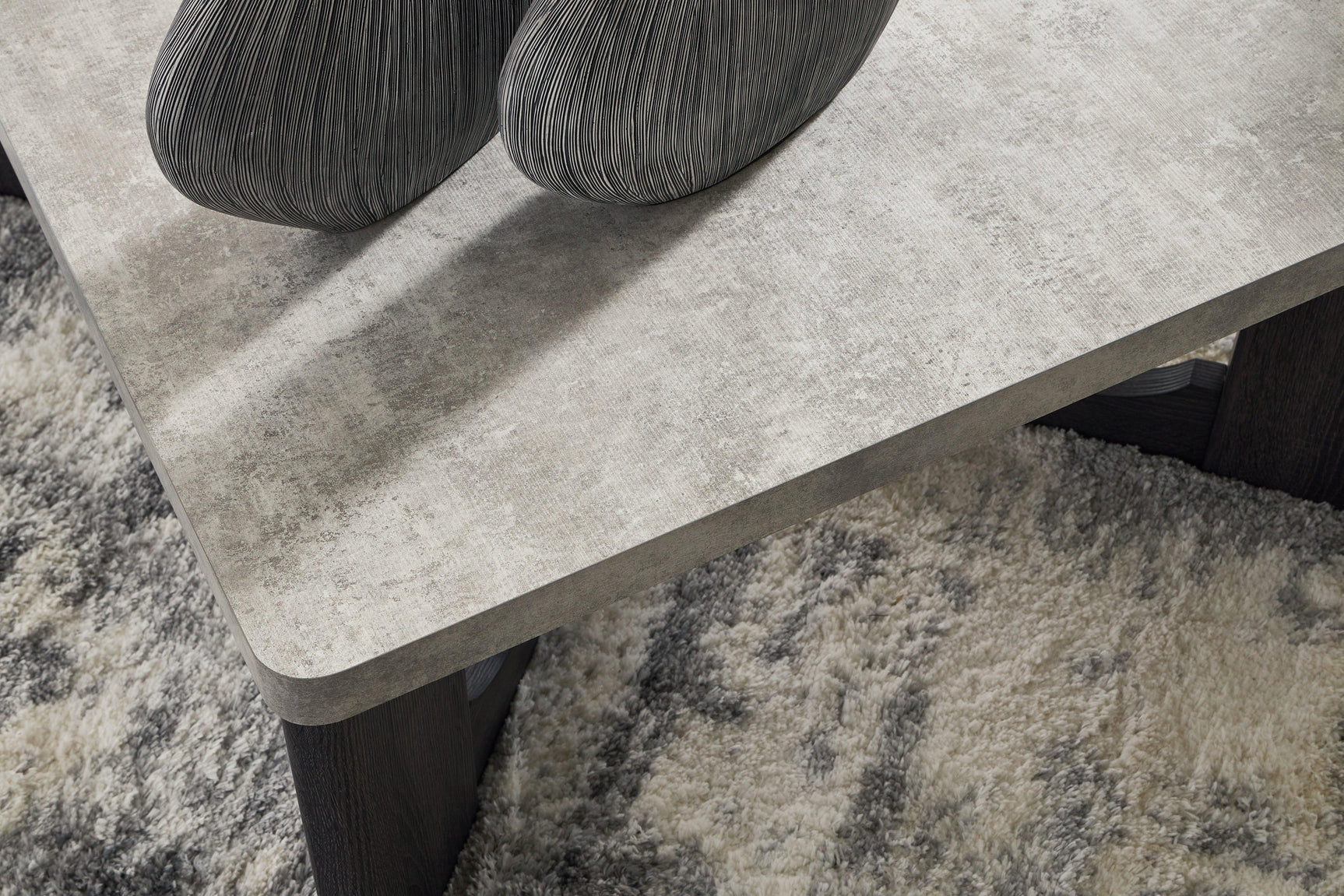 Close-up of Sharstorm coffee table faux cement melamine top