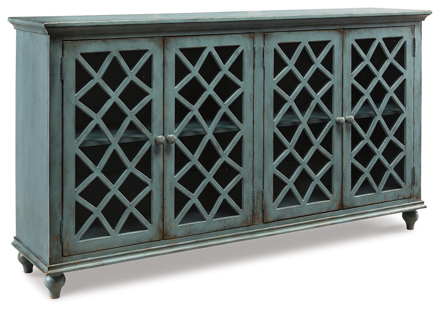 Side angle of Mirimyn Antique Teal Accent Cabinet highlighting distressed finish