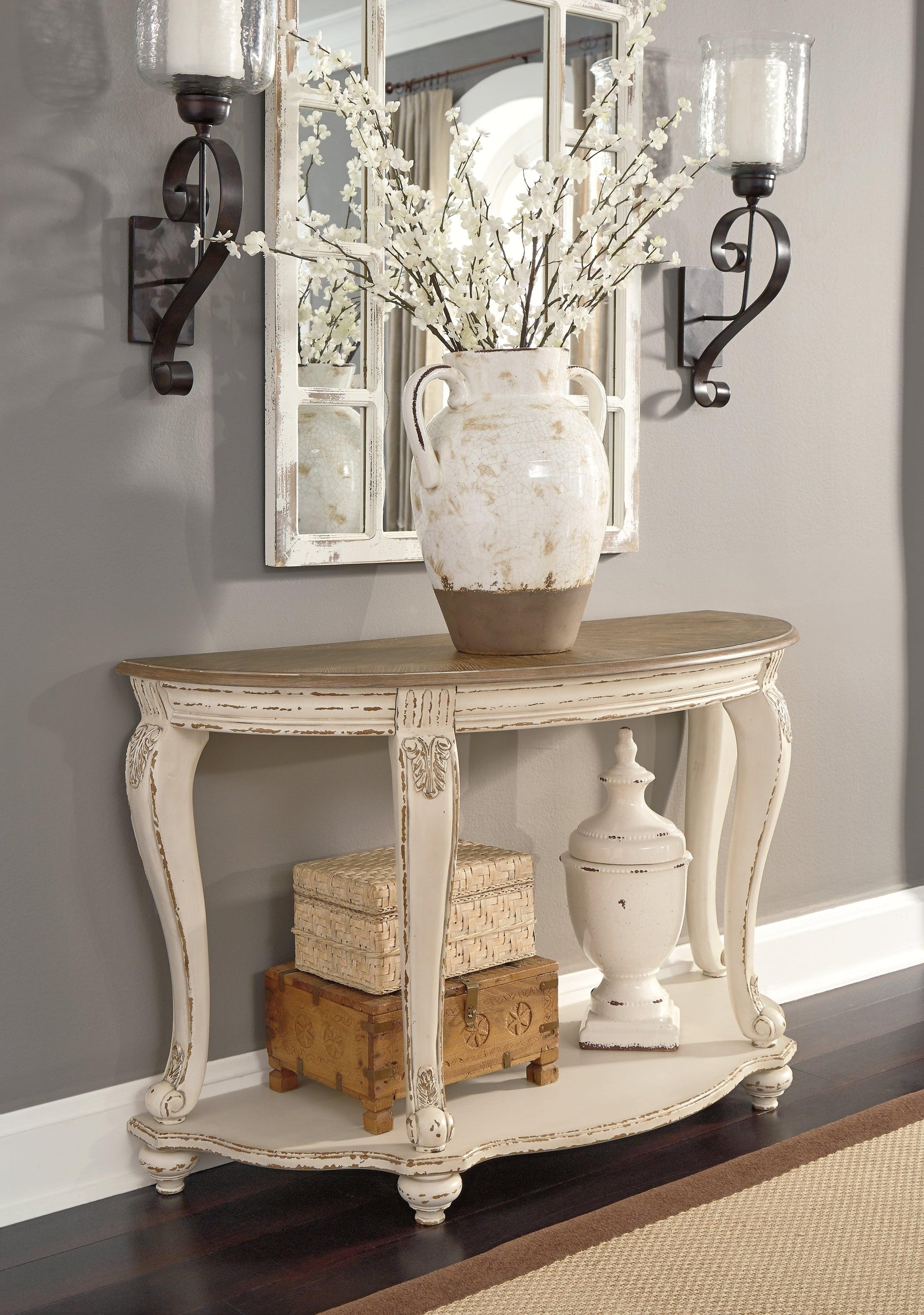 Realyn two-tone sofa table angled view showing overall design