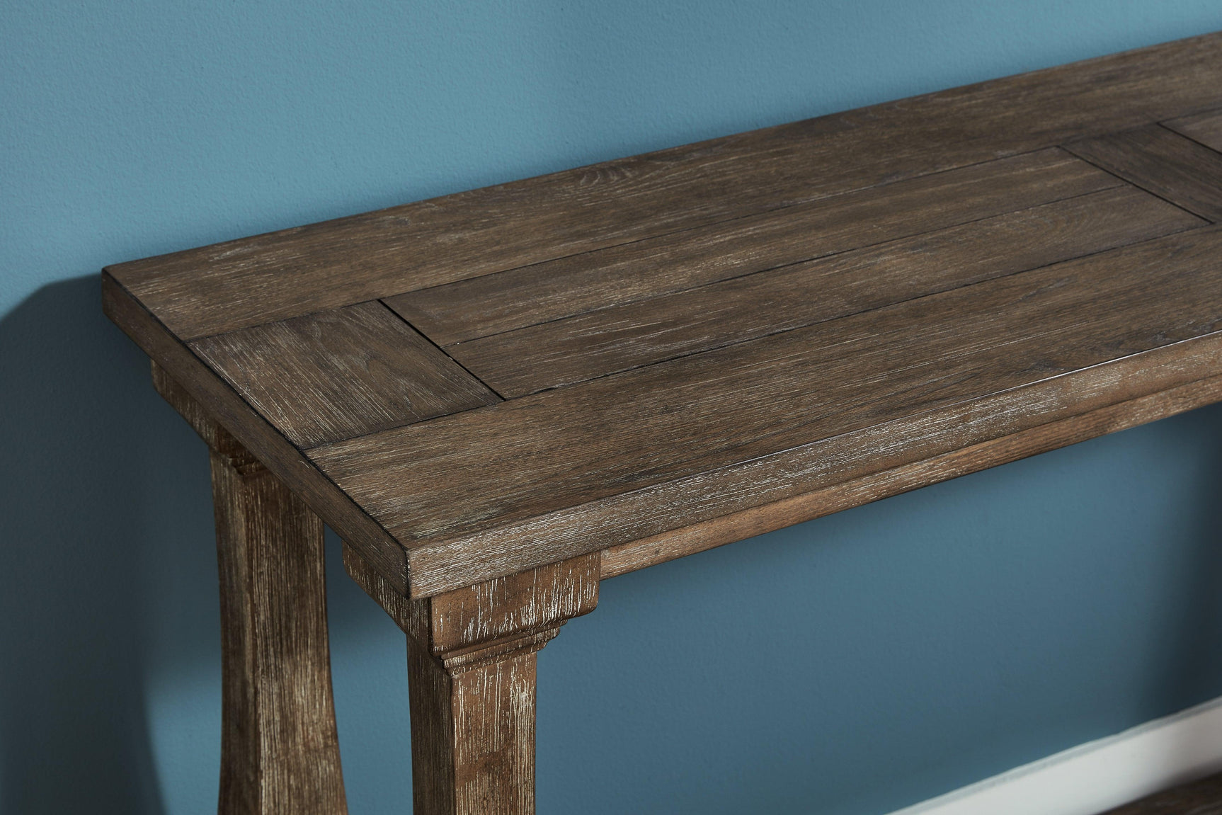 Top view of Johnelle Gray Sofa Table showing plank-look framed wooden top