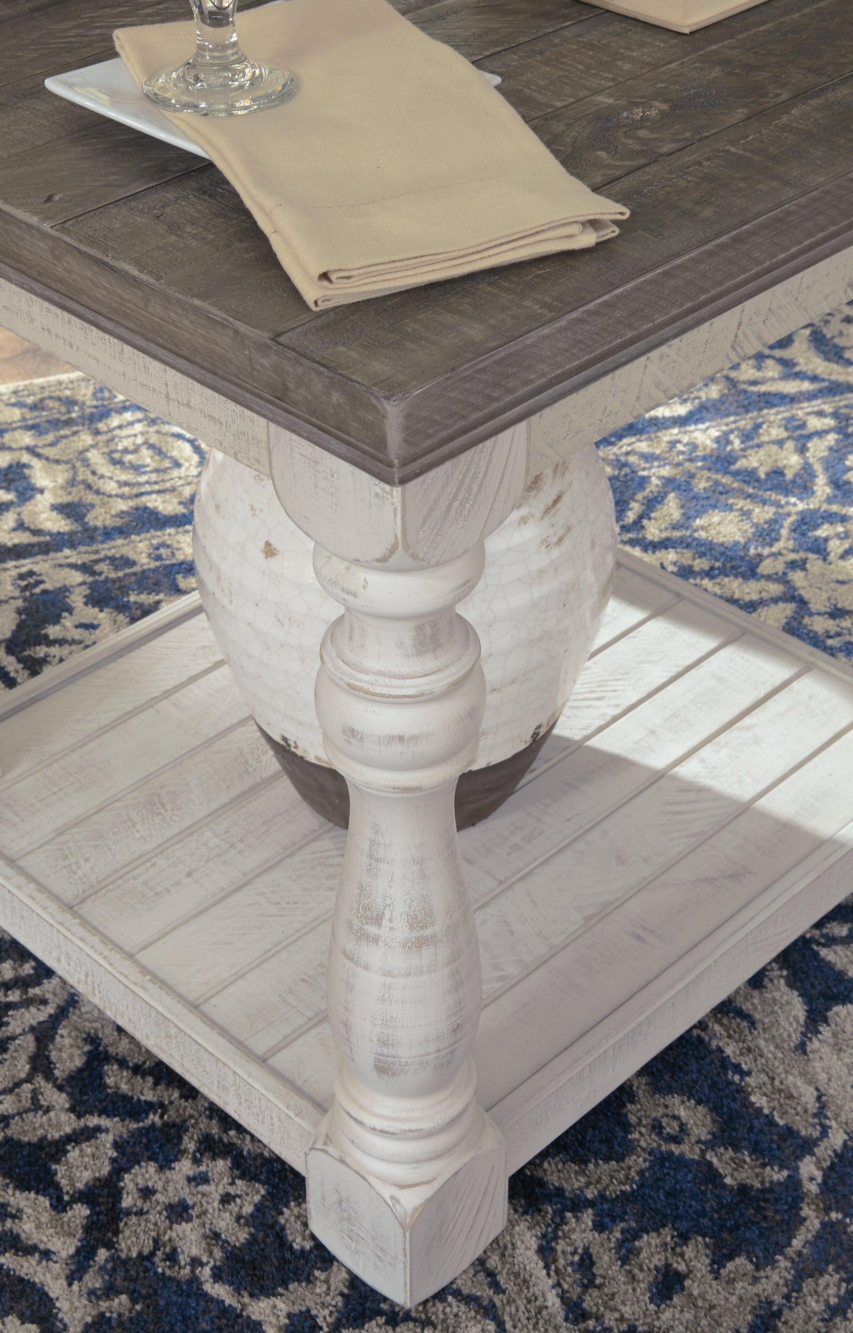 Havalance end table showing weathered gray top and vintage white base