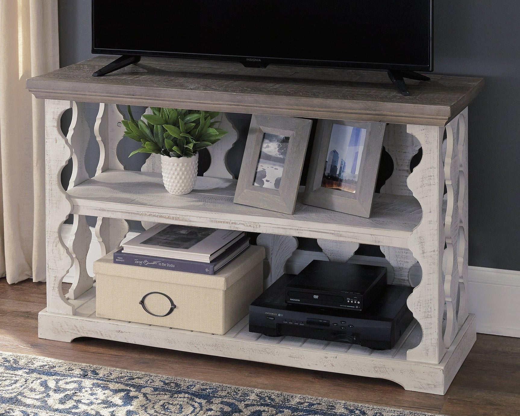 Decorated Havalance sofa console table with books and accessories