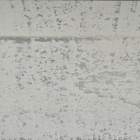 Close-up on vintage white and weathered gray finish