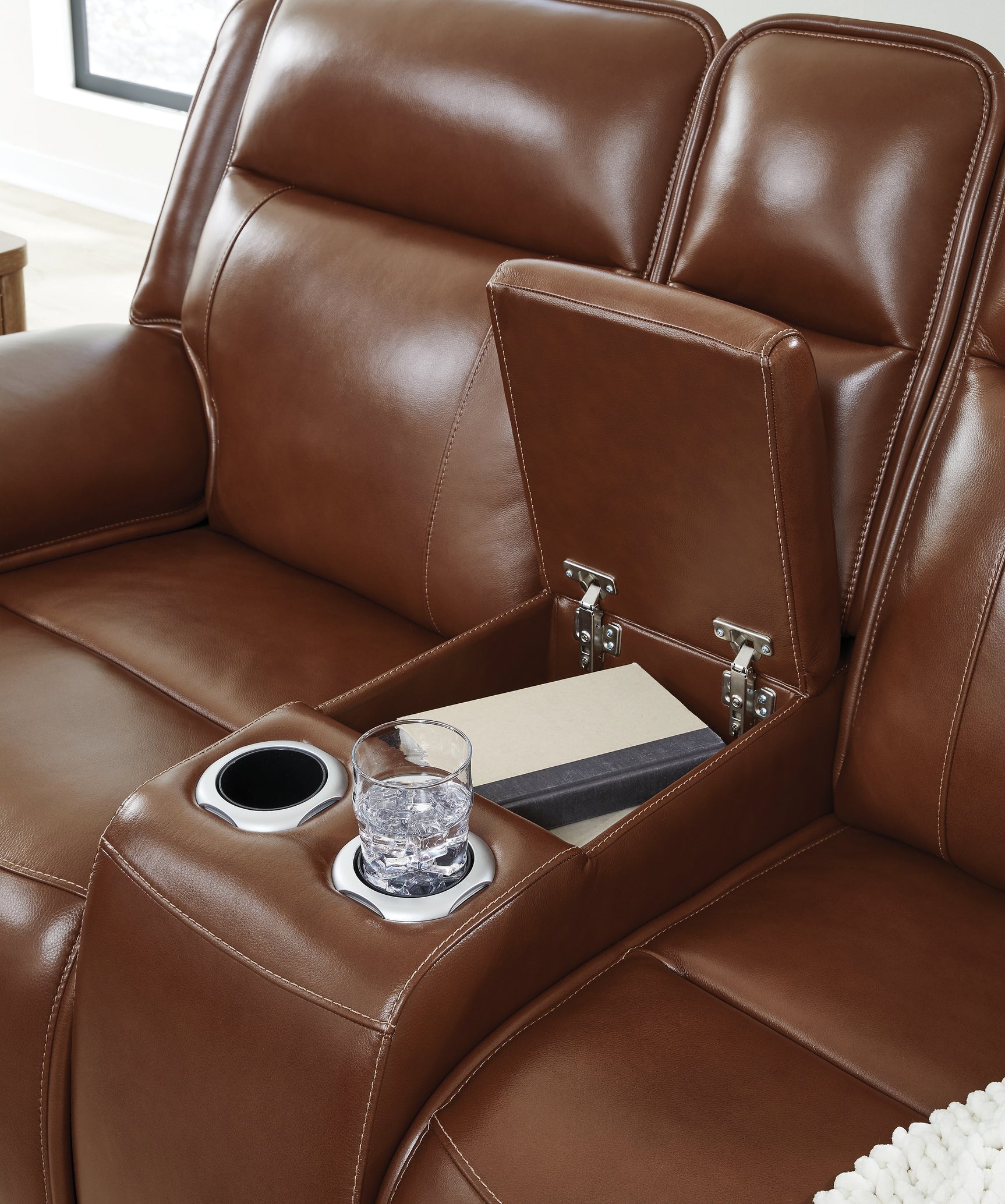Close-up of console cup holders and storage