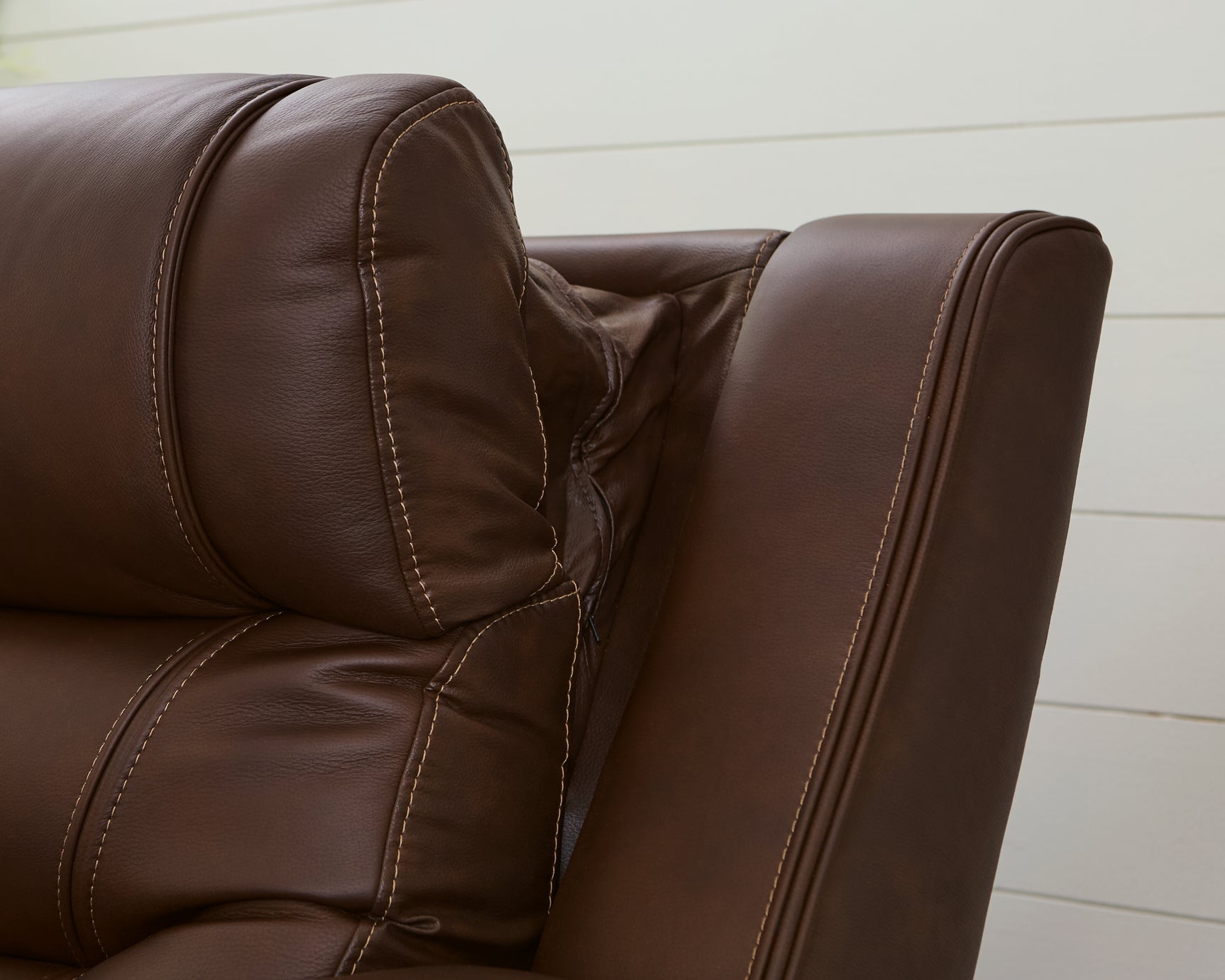 Knightington Brown Leather Power Recliner with Audio Seating adjustable headrest close-up