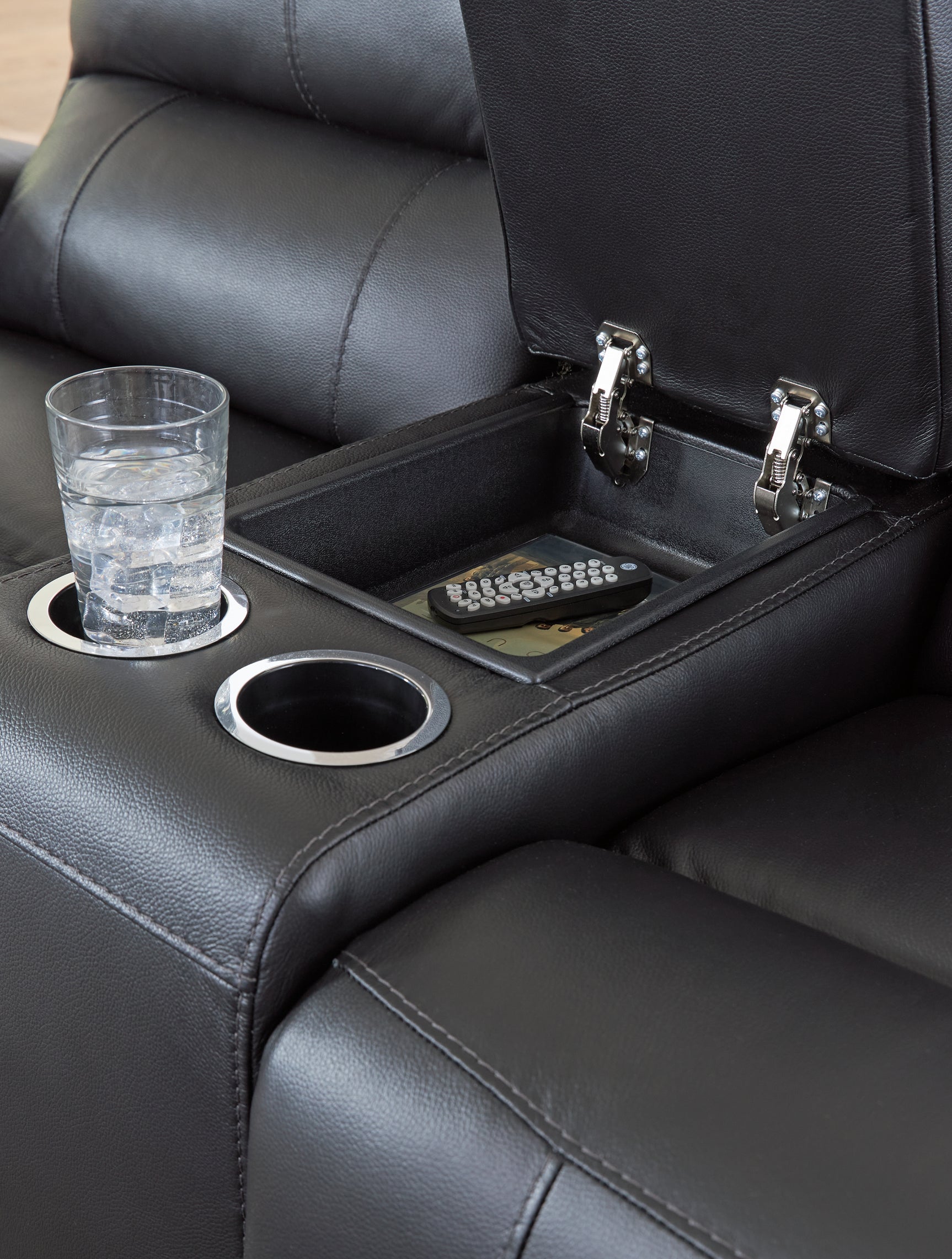 Glossmore Reclining Loveseat console detail showing cup holders