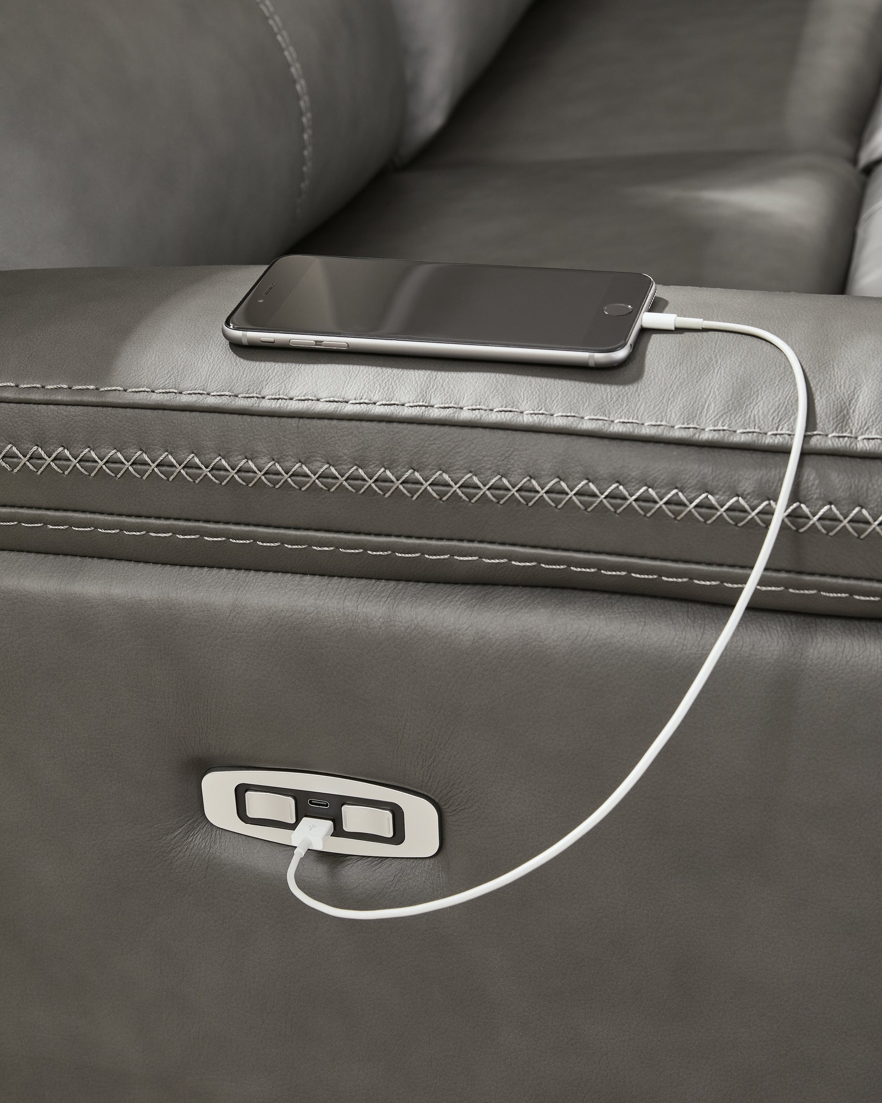 USB-A and USB-C charging ports built into sectional arm