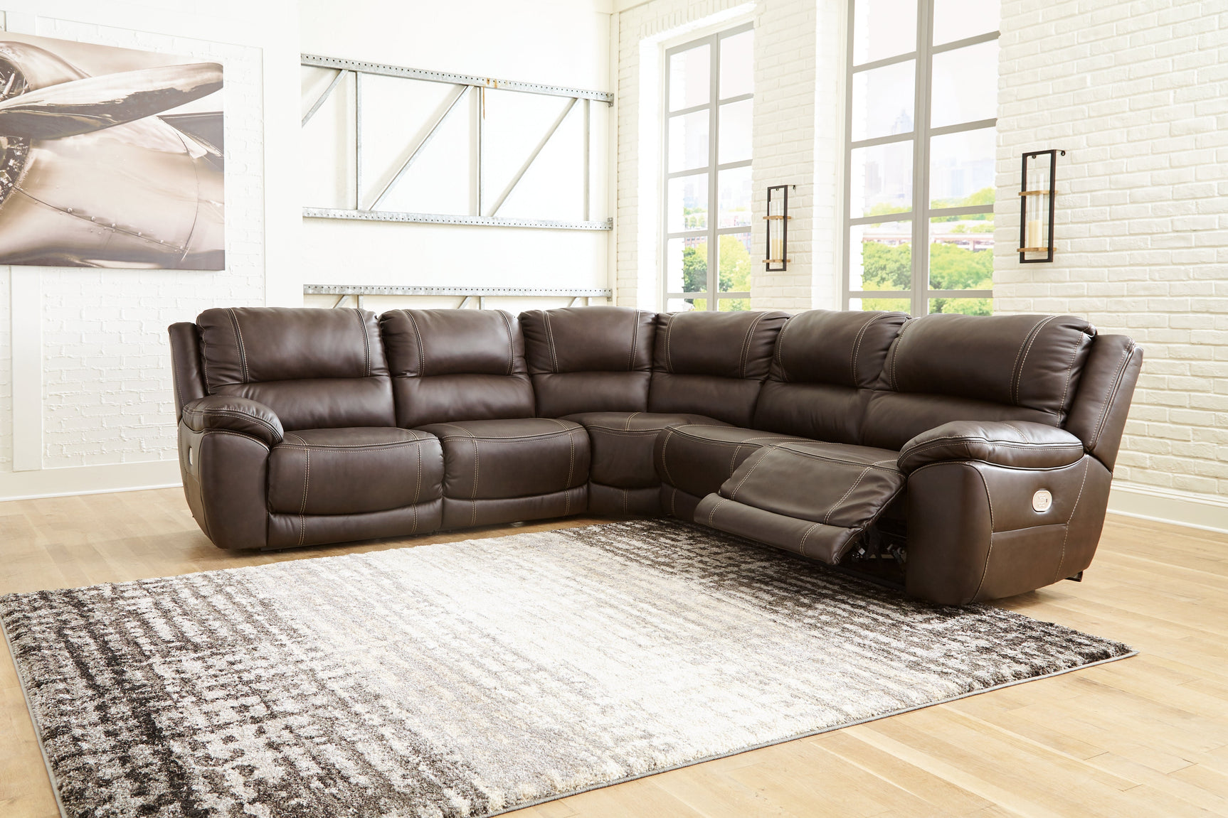 Side view of Dunleith power reclining sectional with extended ottoman