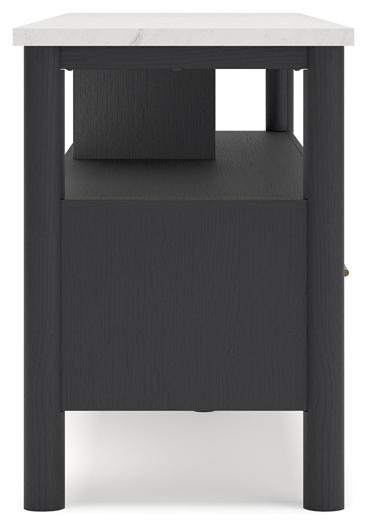 Handle and drawer detail with bronze-tone finish
