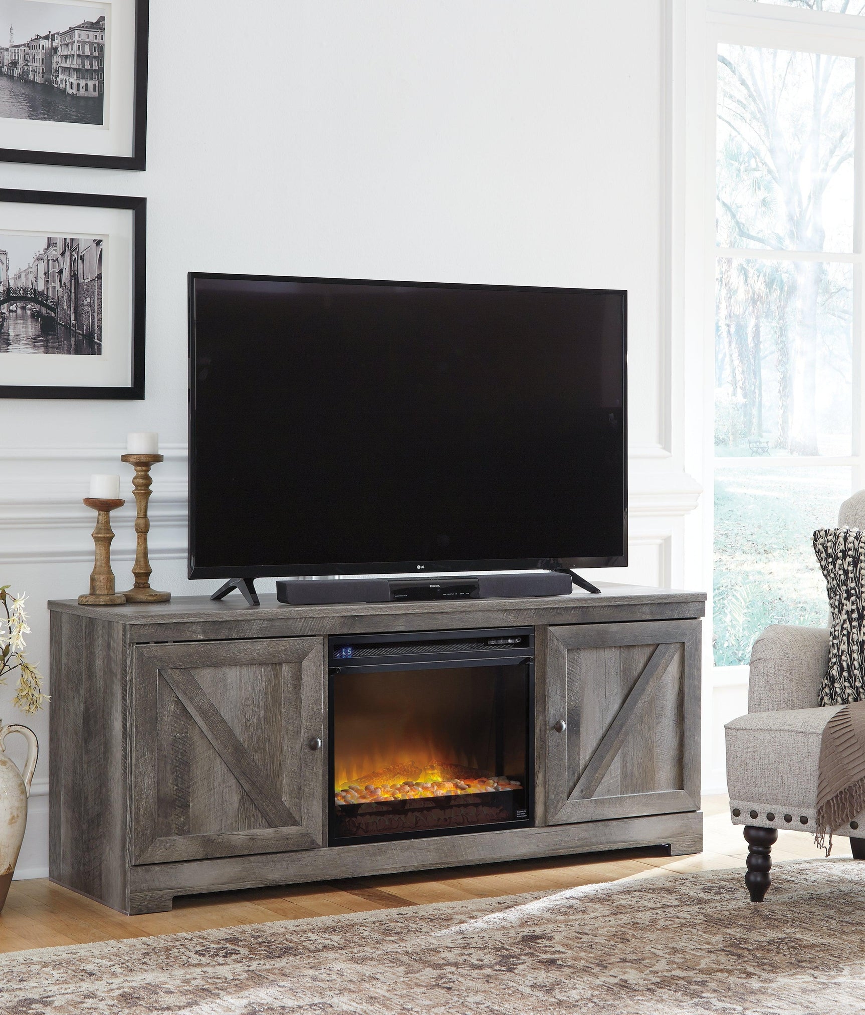 Electric fireplace insert lit inside Wynnlow TV stand