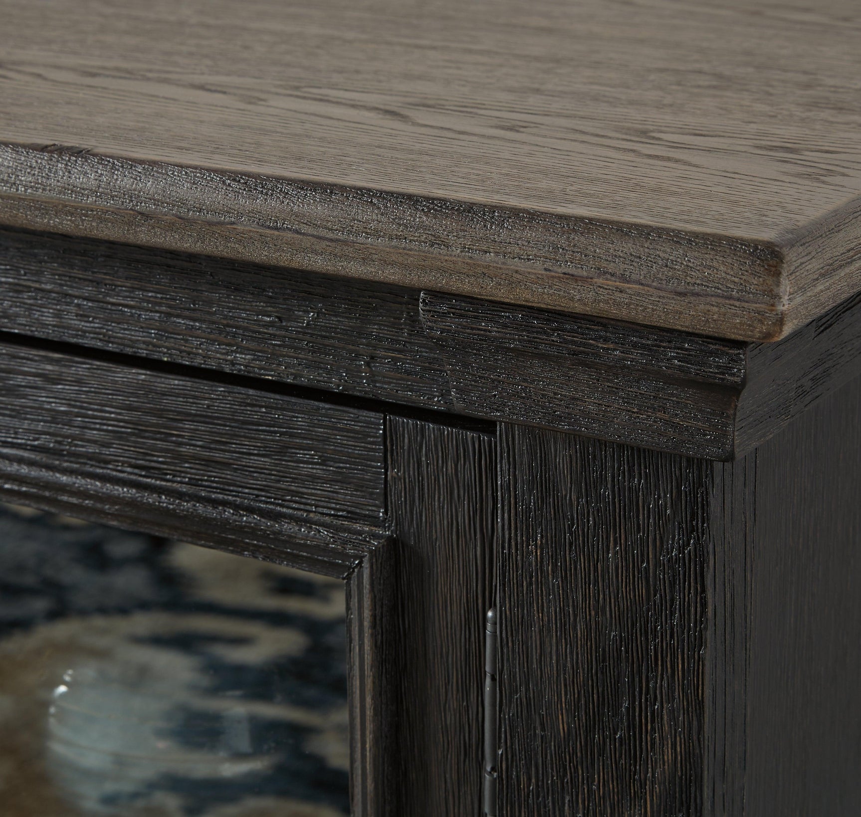 Close-up of Tyler Creek TV stand door and bronze-tone knob
