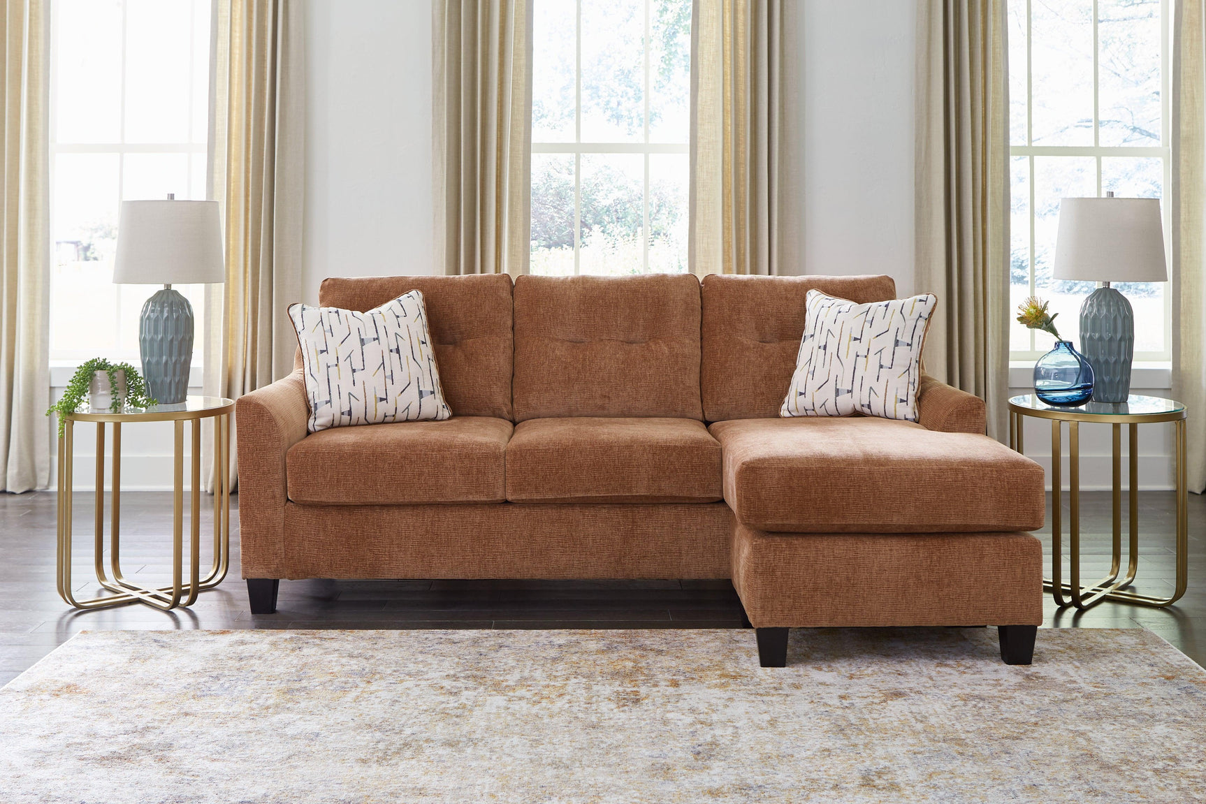 Side perspective of clay chenille sofa with chaise