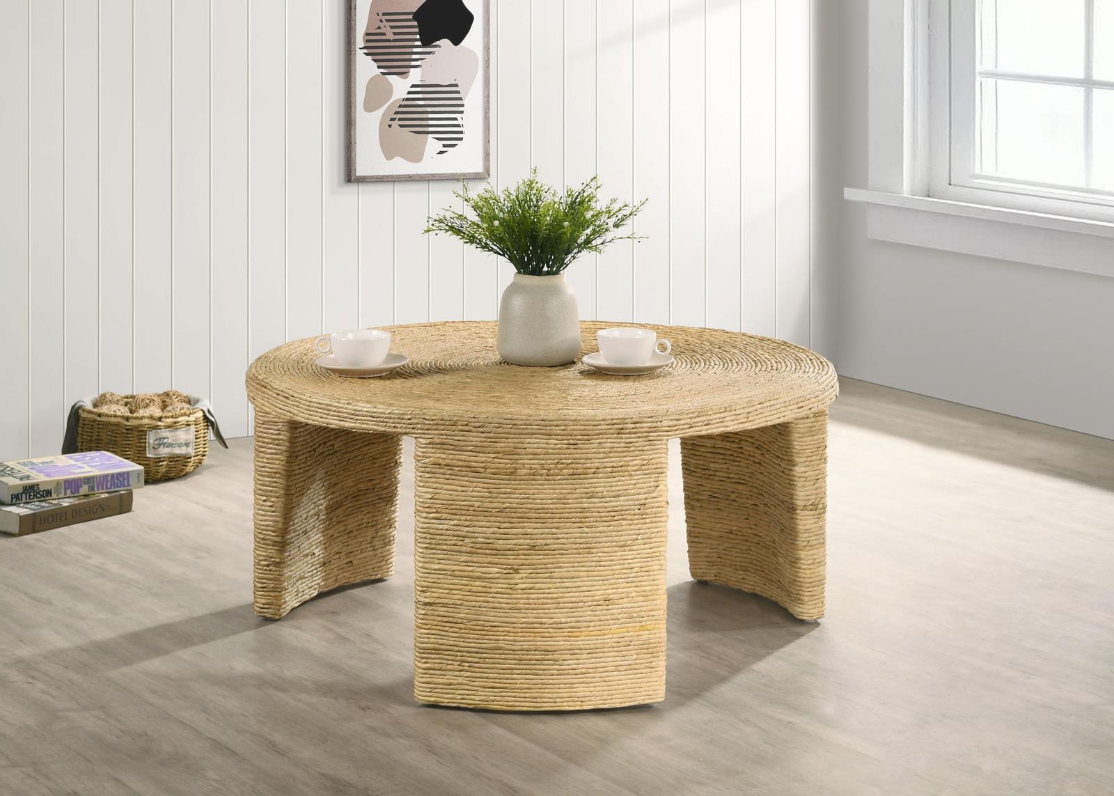 Side view of Artina Round Coffee Table highlighting three bracket legs