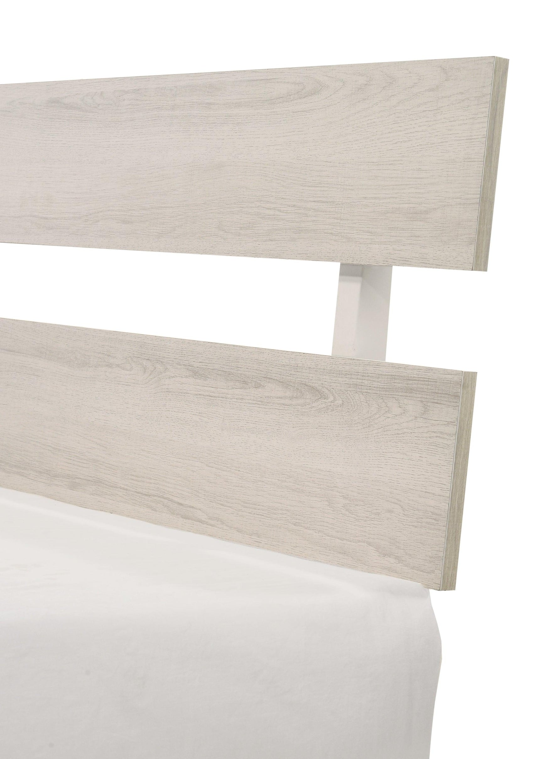 Atticus White twin platform bed angled view with bedding