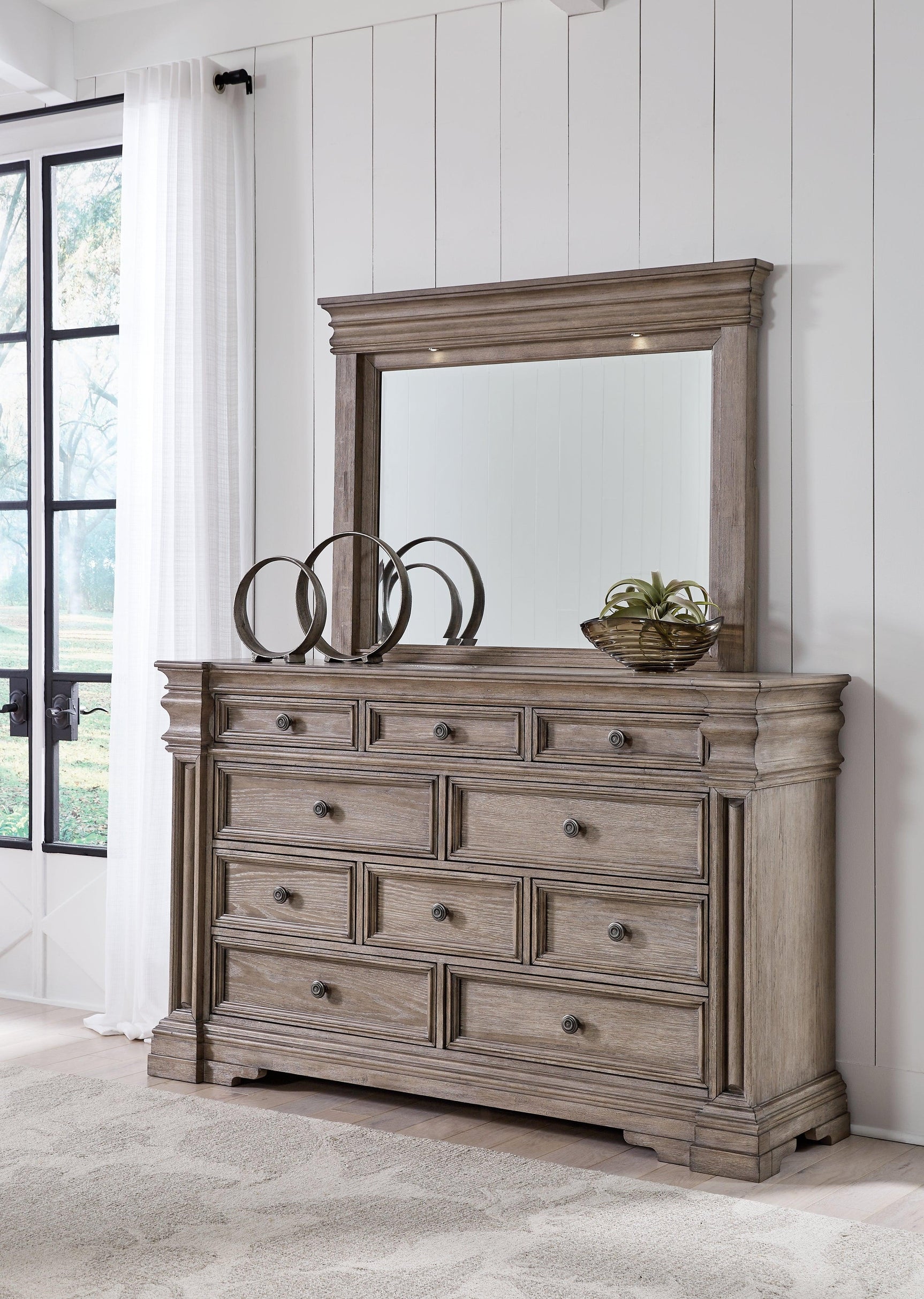 Mirror frame with LED light bridge attached to dresser