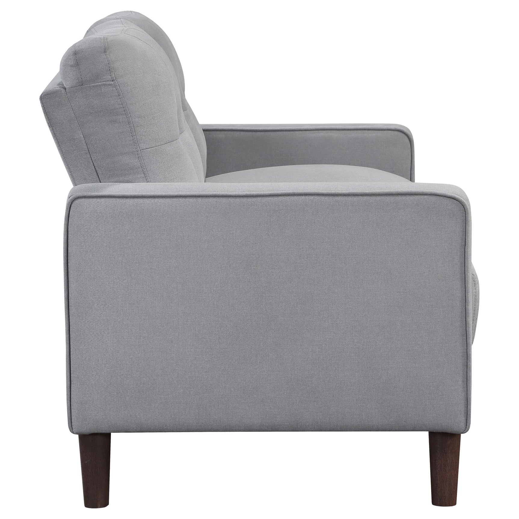 Close detail of tufted upholstery on Bowen sofa arm