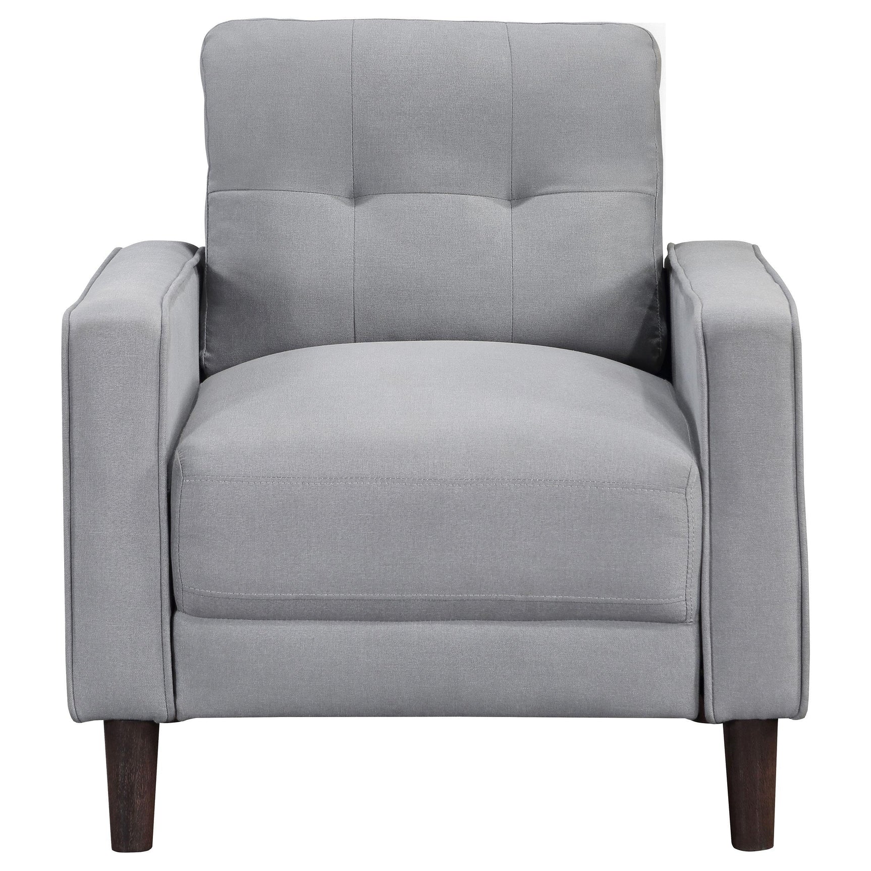 Close-up of tufted stitching detail on loveseat cushion