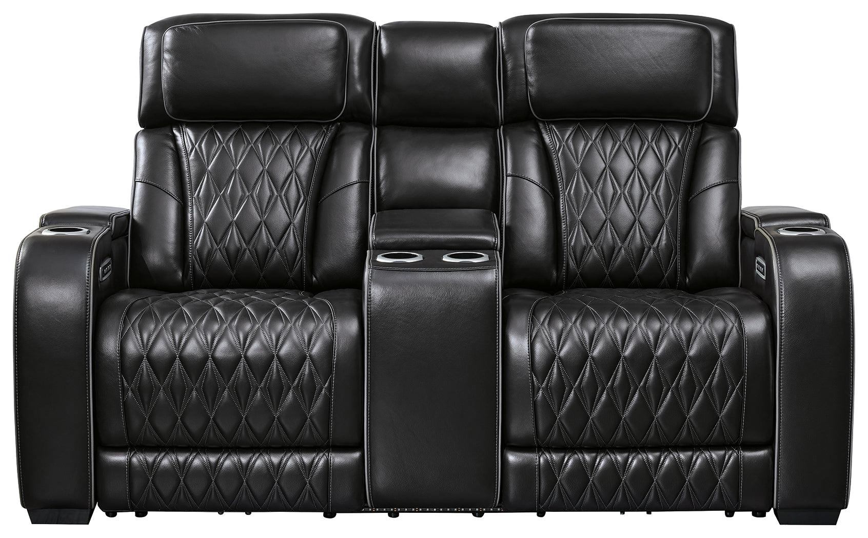 Side angle of Boyington Black Leather Power Reclining Loveseat showing console
