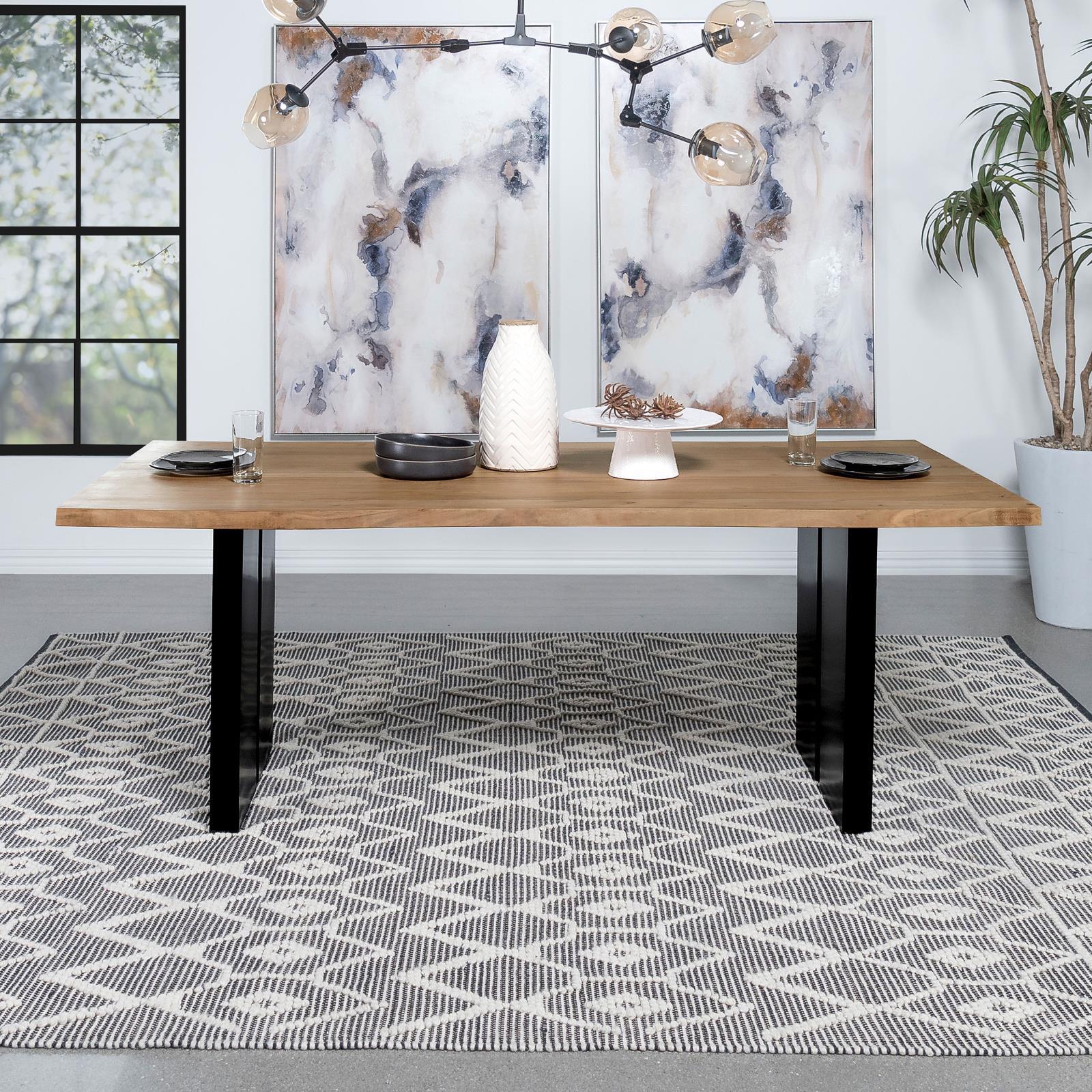 Black iron double pedestal legs under rectangular acacia wood dining table