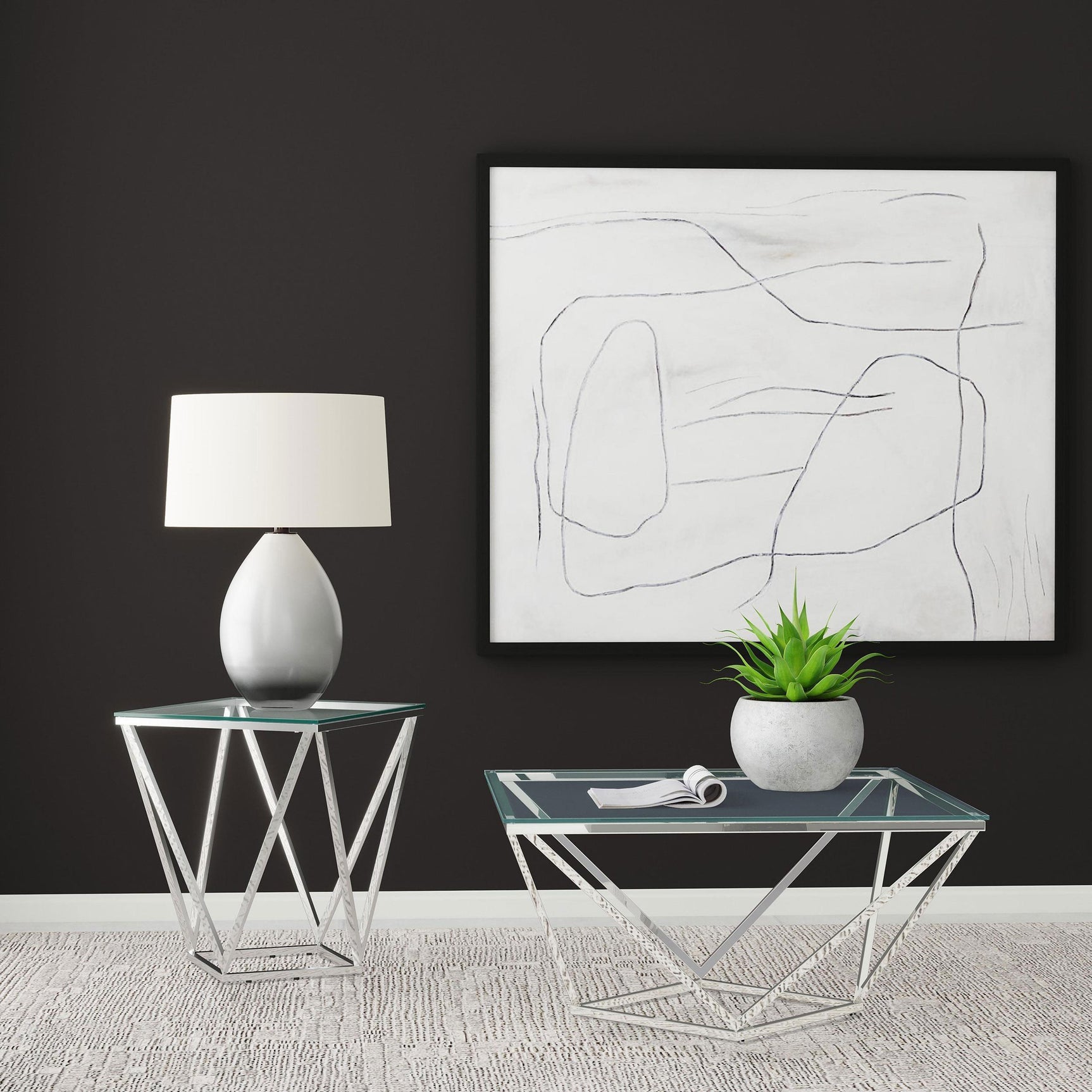 Brittania glass top end table placed next to leather sofa