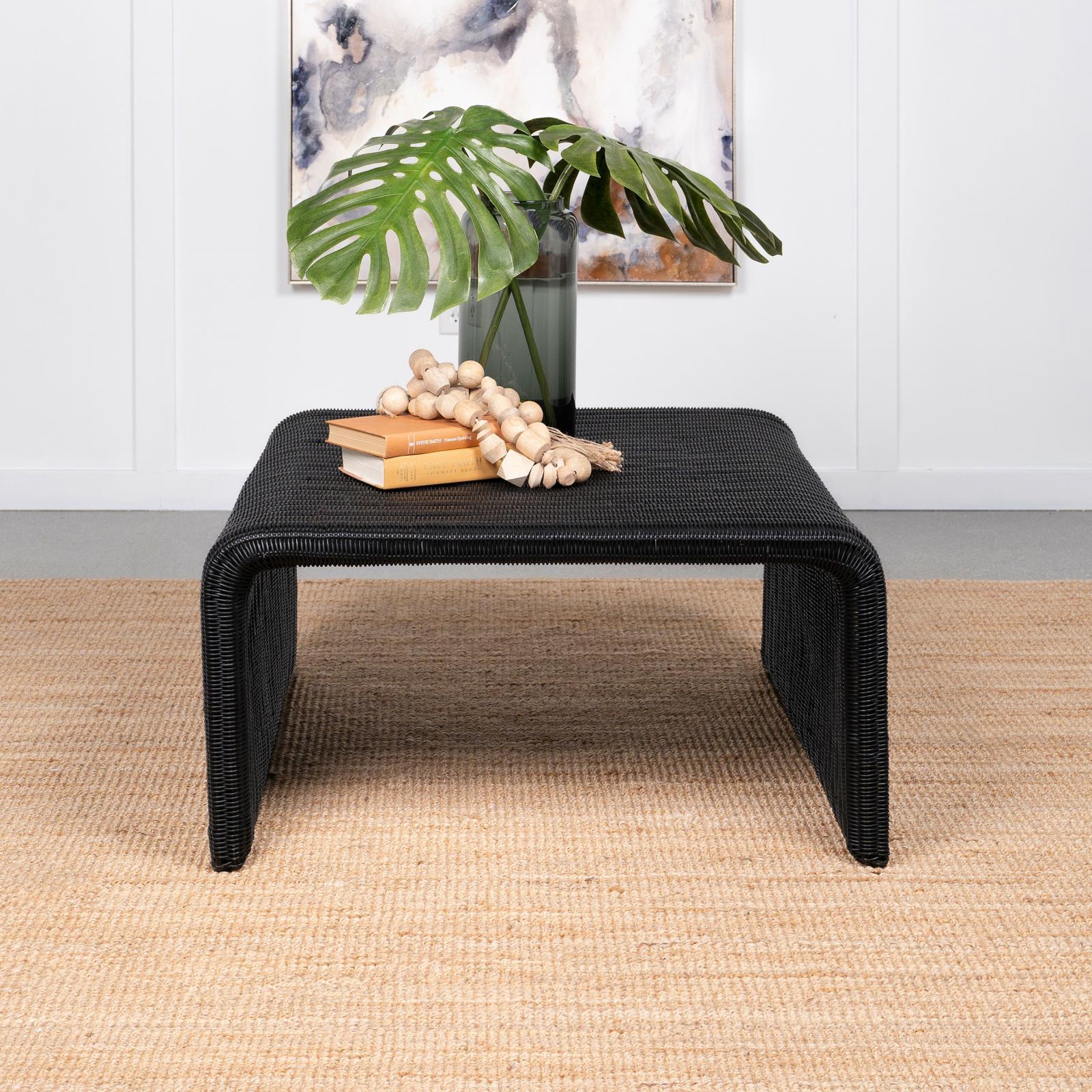 Side angle of Cahya coffee table showing woven rattan surface